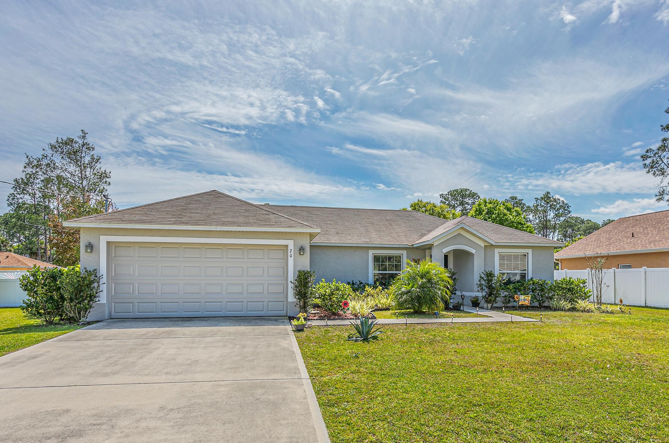 Like New! This 3 Bedroom 2 Bath was built in 2019 "The Carlynn Model  " By Holiday Homes.  Not only is it located convenient to shopping, medical facilities, schools and churches, its a short ride to St Augustine and Daytona Beach.  This home has so many upgrades its Better than new.  The window treatment are done, The kitchen boost up grades such as the appliance package with the double door Refrigerator with freezer drawer on bottom, a large Island with a beautiful modern granite top makes a great Breakfast Bar too. The Kitchen has a good size pantry and the large laundry room comes with the washer and dryer.  The main living space is an open floor plan with a designated Dinning Room, Living Room and Open Kitchen, features a upgraded Luxury Vinyl flooring. Thru the sliders, off of the Living Area is a covered screened lanai.  The bedroom floors are carpeted (in good condition).  The Electric Fireplace in the Living Room will stay. Check out the bathrooms both have easy care finishes.