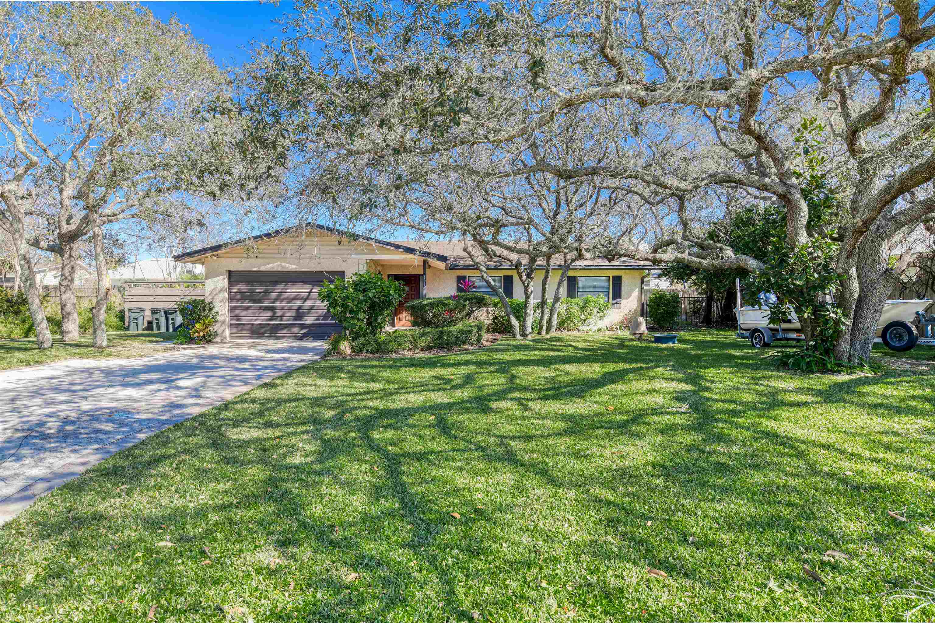 Welcome to this beautifully updated beach home located in the highly sought-after Mickler's Subdivision, just a short 6-minute walk to the beach and boat ramp access! Perfect for beach and nature lovers, this home offers a perfect blend of comfort, style, and relaxation. Step inside to discover a completely remodeled kitchen featuring sleek stainless steel appliances, ample counter space, and modern finishes that make cooking a pleasure. The spacious floor plan includes 4 generously sized bedrooms, ideal for family or guests, 2 bathrooms that have been beautifully remodeled, and a flex room that can be used as a home office, playroom, or additional living space. Step outside into your private backyard oasis, complete with a sleek heated pool and spa, perfect for unwinding after a day at the beach. Gather around the firepit on cool evenings, or entertain guests under the covered gazebo! This home is also currently part of a successful short-term rental program!