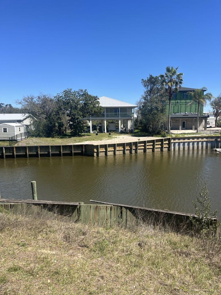 Discover the perfect canvas for your dream home with this exceptional lot in the sought-after Treasure Beach neighborhood. Nestled along the serene canal, this property offers incredible potential for both relaxation and adventure. With picturesque water views and abundant space, it's an ideal location for building your perfect getaway or permanent residence. The community provides exclusive beach access, allowing you to enjoy the best of both worlds—tranquil canal living and the refreshing coastal breeze just steps away. Whether you're looking to create a private oasis or invest in a prime piece of real estate, this lot is full of possibilities. Seize the opportunity to own a slice of paradise in one of the most desirable neighborhoods. Don’t miss out on making this hidden gem your own!