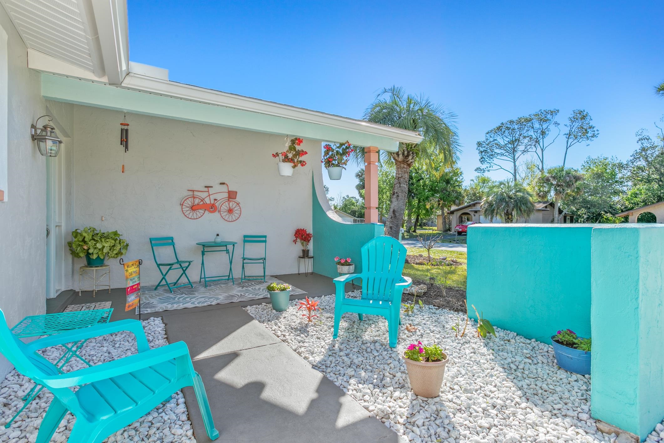 Discover your dream home in this beautifully updated freshwater canal-front retreat! This solid concrete block home boasts a brand-new roof (2024) and a new hot water heater (2025) for peace of mind. Enjoy a spacious 2-car garage and a newer extended concrete driveway—perfect for extra parking. Step inside to find real hardwood floors throughout, an inviting open floor plan, Wood burning Fireplace for chilly evenings and a cozy kitchen featuring granite counter tops and stainless steel appliances. The primary en suite features a walk-in shower, large garden tub, and dual vanities. Updated Hurricane Impact vinyl windows let in plenty of natural light, while the screened-in Florida room provides the perfect spot to enjoy the tranquil canal views. Outdoor lovers will adore the fully fenced, pet-friendly yard, offering privacy and plenty of space to relax or play.