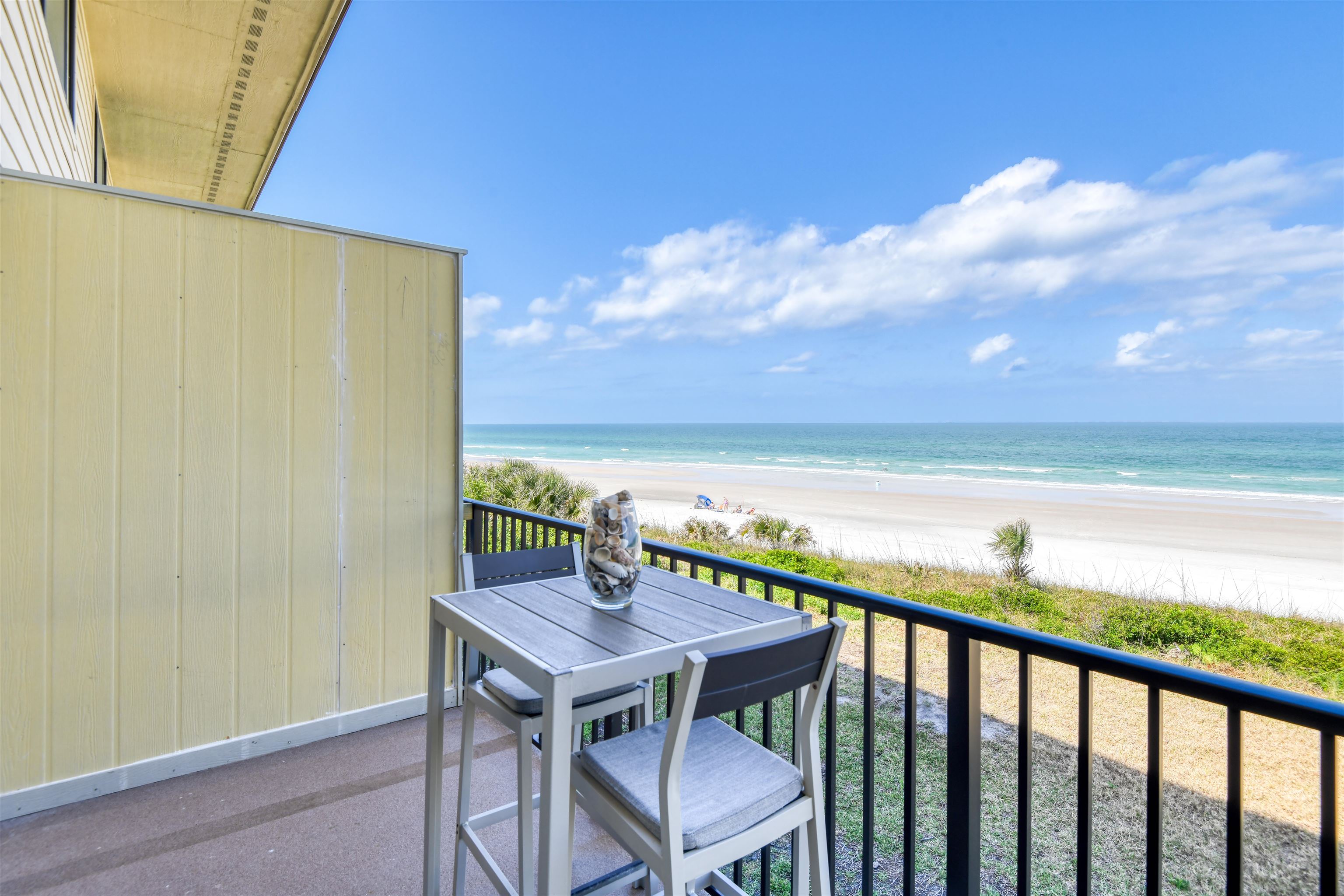 Wake up to the sound of waves and breathtaking direct ocean views from this beautifully updated 2-bedroom, 2-bathroom condo in the highly desirable Summerhouse community. This two-story gem features new flooring throughout, a pretty kitchen with granite countertops, stainless steel appliances, and a spacious living area that opens to a private balcony with panoramic ocean views. The primary suite is a true retreat with unbeatable ocean views and an updated ensuite bathroom with a updated walk-in shower. As part of the onsite rental program, this condo is not only a dreamy getaway but also a fantastic investment opportunity. Enjoy the benefits of rental income while owning a slice of paradise. Summerhouse offers resort-style amenities, including 4 heated pools, 4 private beach walkovers, gated security, tennis and basketball courts, pickleball, playground, fitness center, RV/boat storage, car wash station, and a clubhouse—everything you need for the ultimate beachside lifestyle!