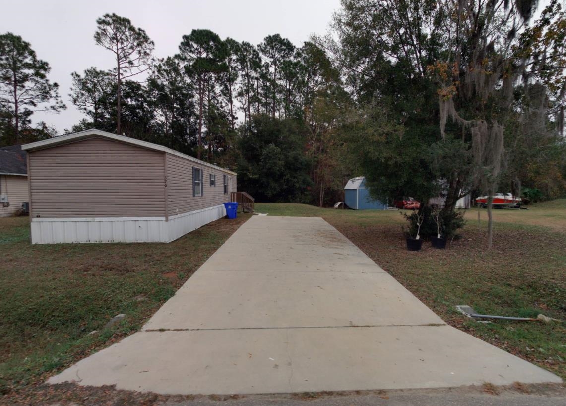 This well-kept 3-bedroom, 2-bath mobile home offers comfort and convenience just minutes from downtown, shopping, and dining. A perfect option for those seeking value and accessibility in a prime location! Additional lot next door may be purchased with mobile home for additional $55,000!