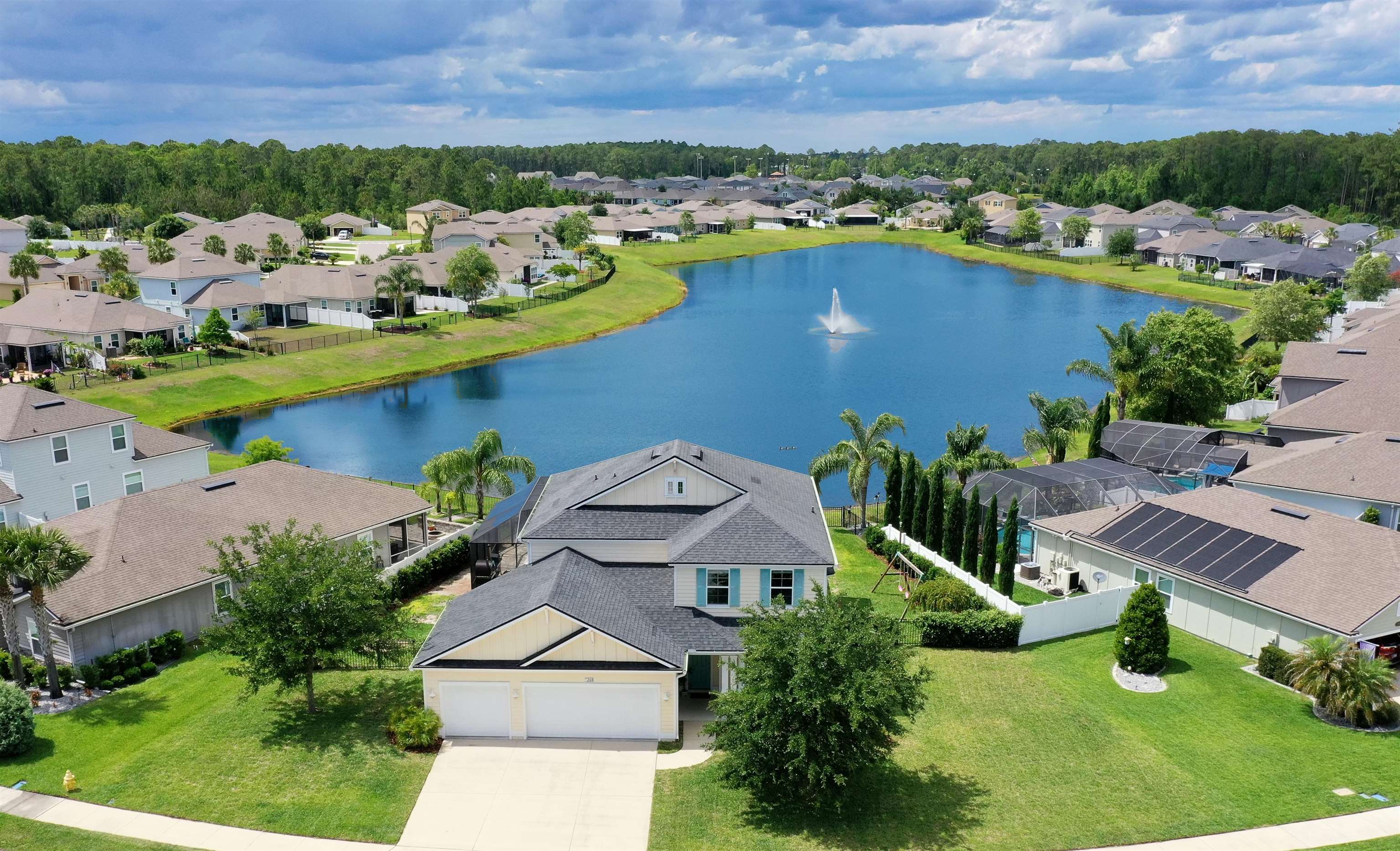 SELLER IS OFFERING $10,000!!! TOWARDS BUYERS CLOSING COSTS. Amazing pool/spa home with expansive lake views in Andalusia. This home offers everything! At nearly 3,000sf, this 4 bdr, 2.5 ba with primary on the main and an upstairs bonus area offers an option for every living requirement you may have. The indoor to outdoor transition is outstanding with a large lanai leading to an exceptional and oversized heated and screened pool/spa with lounging shelf and a full outdoor fireplace overlooking the lake. Beautiful new tongue and groove ceiling on the outdoor lanai. A 3 car garage, fully fenced yard, security system, water softener and wood laminate upstairs bedroom floors are just some of the upgrades to the open living floor plan. Perfect for family life, the community has a pool, clubhouse, exercise facility, 3 playgrounds and a fairy garden along with being adjacent to Treaty Park and all of the recreational activities offered there.