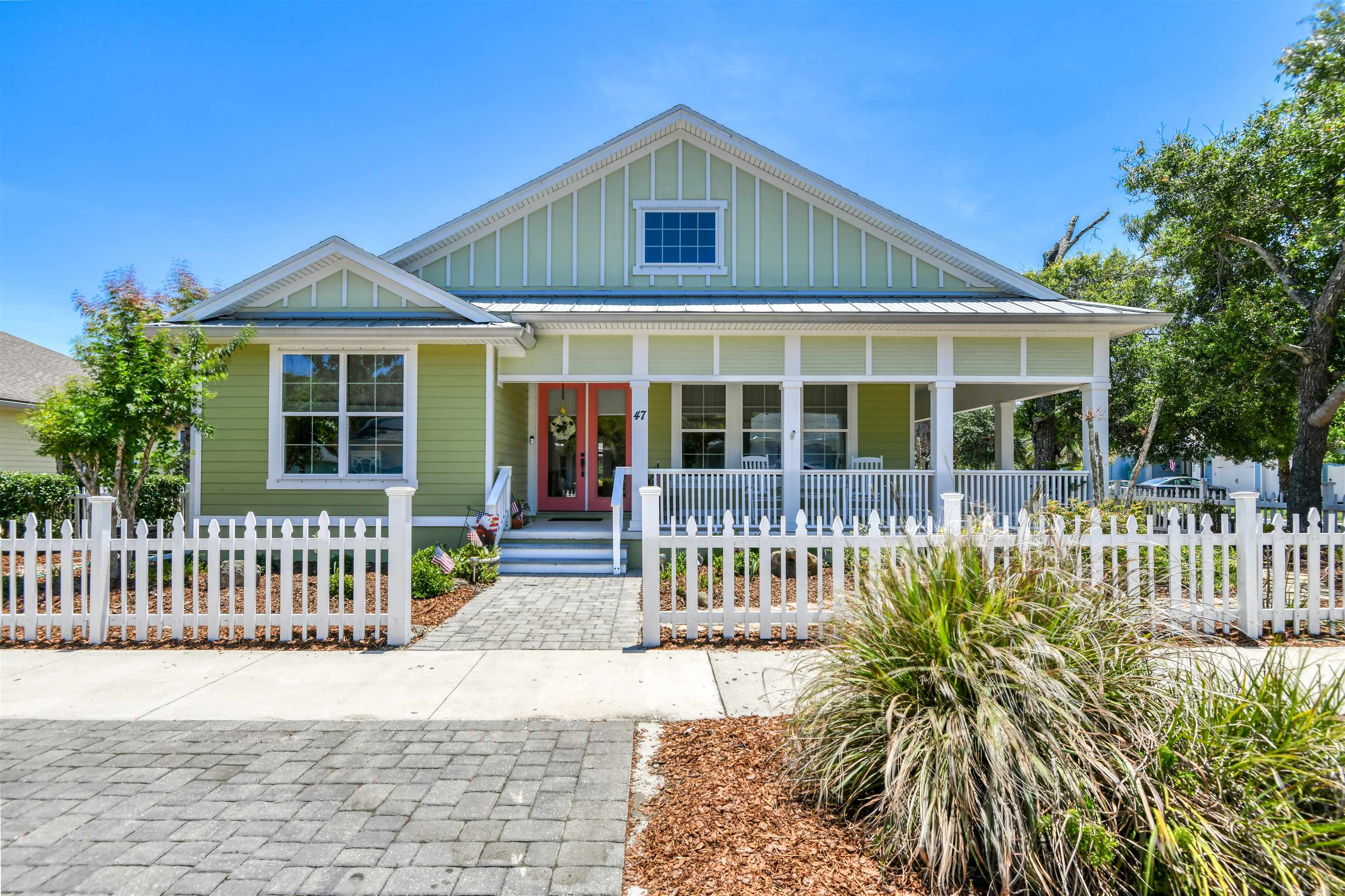 Step into this charming 3-bedroom, 2-bath Key West cottage-style home, perfectly nestled in the highly sought-after Beach Haven Community. Surrounded by a classic white picket fence, this property exudes curb appeal and beachside charm. Enjoy morning coffee or sunset breezes from the covered front porch, or entertain guests on the spacious screened-in back porch overlooking the lush backyard! Inside, the open floor plan invites natural light to flow seamlessly through the living areas. The beautifully appointed kitchen is a chef’s dream, featuring stainless steel appliances, sleek granite countertops, crisp white cabinetry, and a vibrant, colorful backsplash that adds a pop of coastal flair. The home’s layout provides both comfort and style, perfect for gatherings or quiet relaxation.