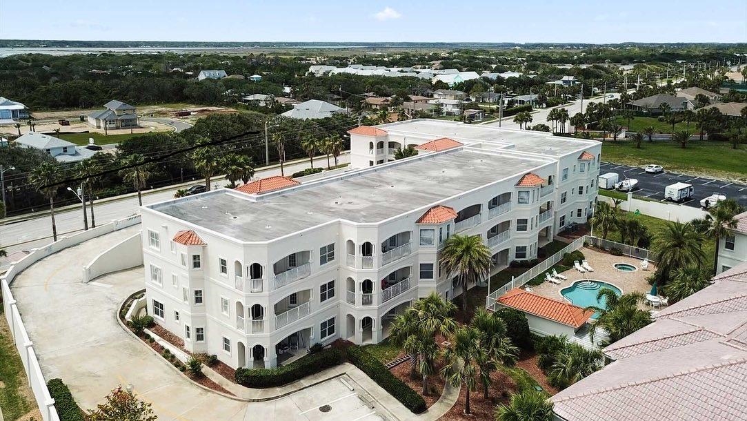 A Deluxe Corner Unit, 3 Bedroom 2 Bath Flat, 10Ft Ceilings, Cherry Cabinets, Corian counter tops, Plantation Shutters, Primary with double all in closets, double vanities and large tub-separate shower.  Being sold rent ready...  The community has 2 pools, spa, tennis, Beach Access and covered garage parking.