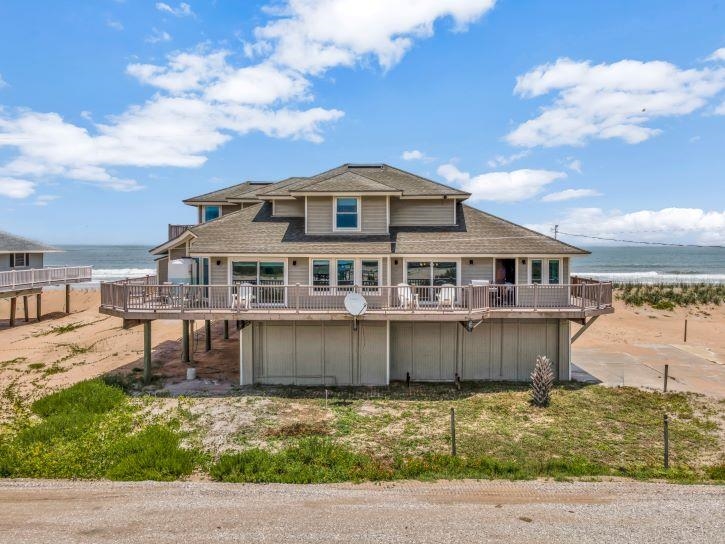 Welcome to a once-in-a-lifetime opportunity to own a truly exceptional seaside home in the highly coveted and private Summer Haven community. Nestled along a quiet, private road with no public beach access, this direct oceanfront estate also boasts rare river frontage—offering breathtaking panoramic views of both the Atlantic Ocean and the Summer Haven River. Designed to maximize its stunning surroundings, this 4-bedroom, 3-bathroom coastal retreat features a wrap-around porch where you can savor both sunrises over the ocean and sunsets over the river. Every room in the home offers a view, filling the space with natural light and the soothing ambiance of coastal living.
