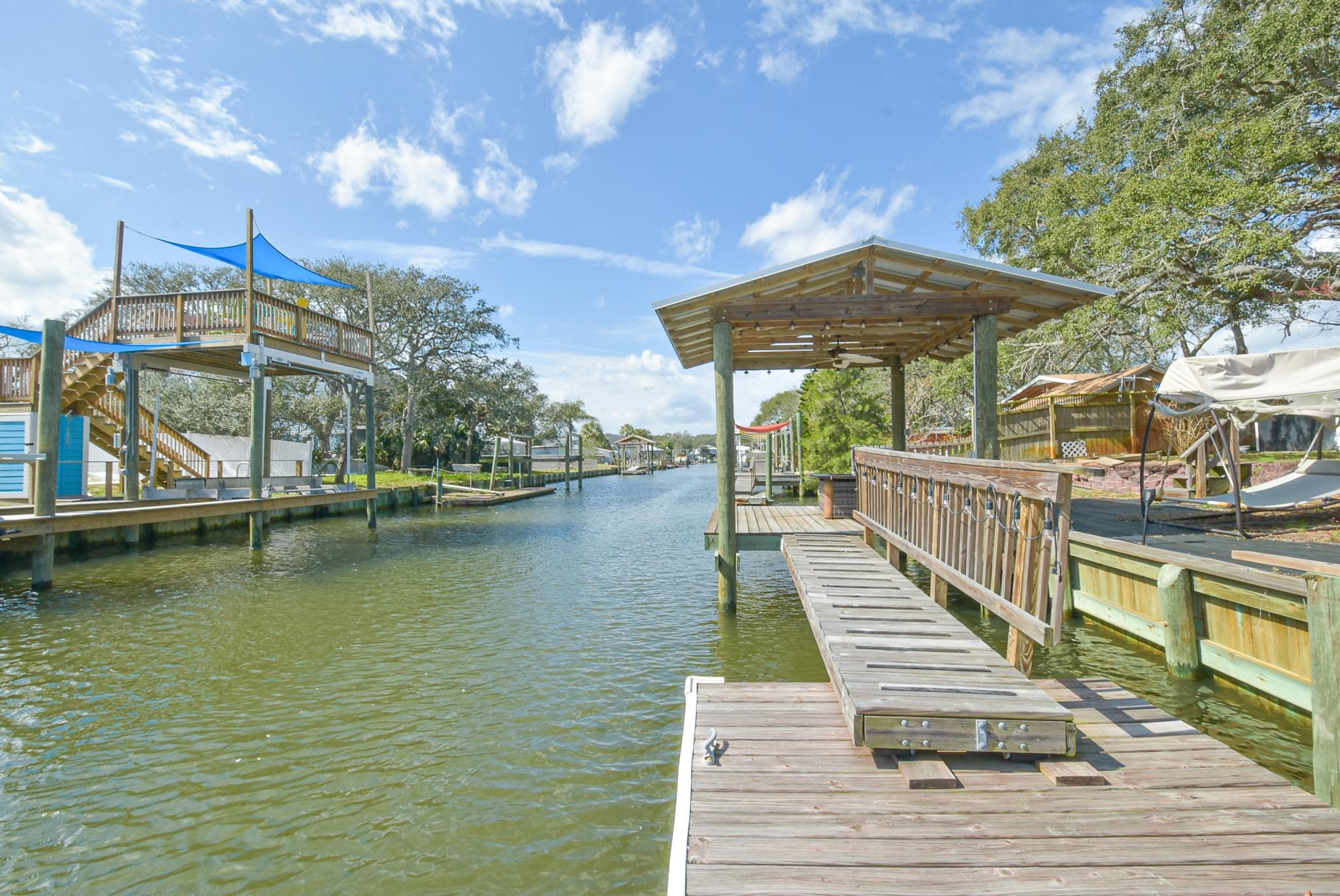 Welcome to your charming retreat in the sought-after Treasure Beach community! This delightful 2-bedroom, 2-bath mobile home offers the perfect blend of comfort, character, and location. Featuring new windows and a fun retro vibe, this property exudes personality while providing modern updates for peace of mind. Situated directly on the canal, you can enjoy serene water views and the convenience of launching your kayak or boat just steps from your back door. Treasure Beach residents enjoy private beach access, making it easy to spend your mornings with your toes in the sand. With no HOA, you have the freedom to truly make this home your own. Perfectly located near shops, restaurants, and the vibrant charm of Historic Downtown St. Augustine, this home offers the ideal balance of relaxation and convenience. Whether you’re seeking a full-time residence, a vacation getaway, or an investment property, this Treasure Beach gem checks all the boxes!