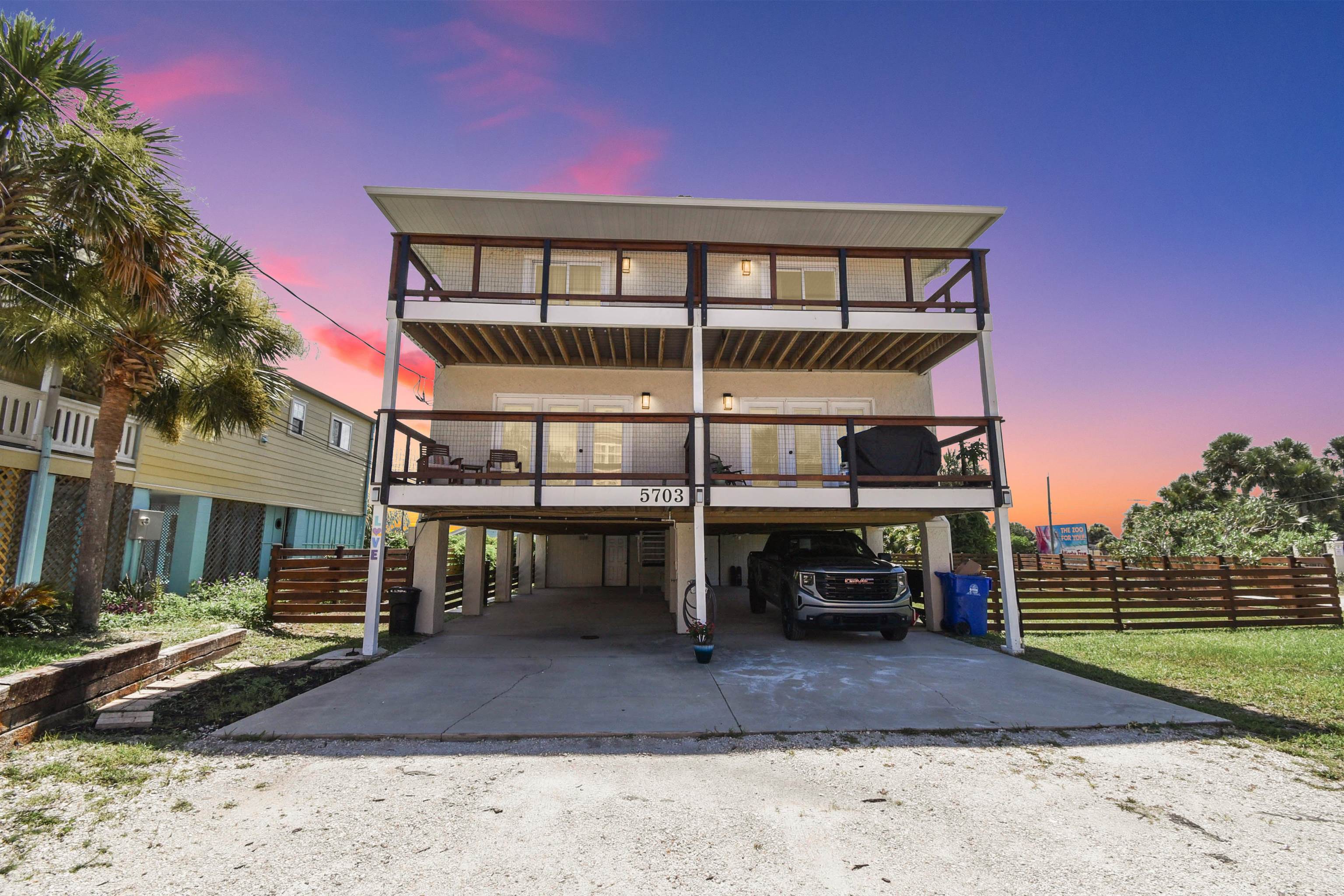 Available NOW! Experience the best of coastal living in this stunning fully furnished oceanview townhome in St. Augustine Beach. Just steps from the sand, this spacious 3-bedroom, 2-bath home offers comfort, convenience, and unbeatable views. Wake up to the sunrise from one of two private oceanview decks. Inside, enjoy a modern, fully updated kitchen with stainless steel appliances, luxury vinyl plank flooring throughout, and the added convenience of an in-unit washer and dryer. This home includes covered parking, a shared yard, and ample storage for bikes, surfboards, and all your beach gear. Pet-friendly with a non-refundable pet deposit bring your furry friends along!  Ideally located less than a block from the beach and right next to Mary Street, which offers vehicle access to drive directly onto the sand perfect for bringing along your chairs, coolers, and surfboards with ease. Close to shopping and dining, this rental offers the ultimate beachside lifestyle. A long-term lease