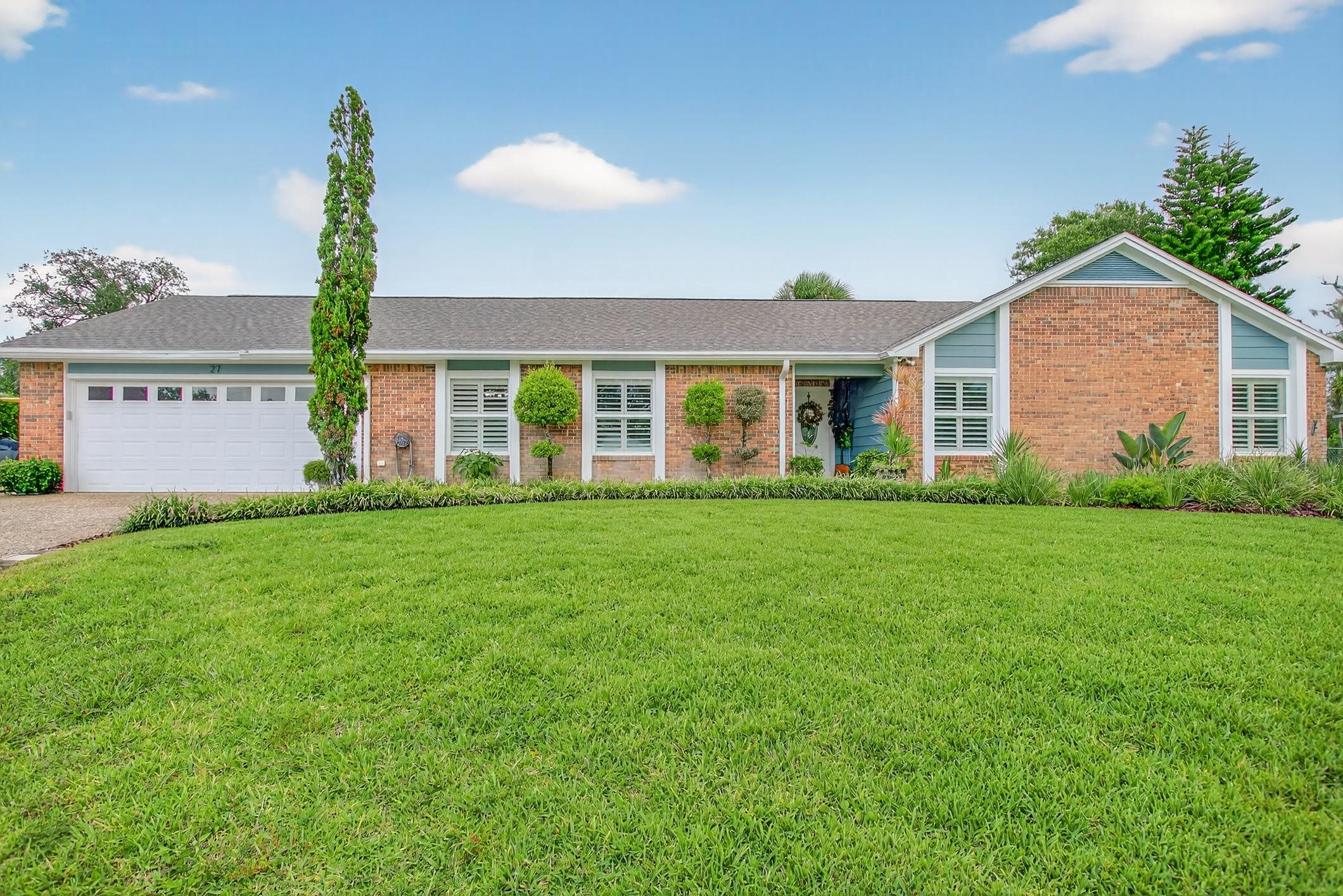This one is done move in ready for new owners!  This 5 Bedroom 3 and 1/2 Bathroom home has been updated with Beautiful Tile and Plantation Shutter thru out. The floor plan offers a Formal Dining room, a Formal Living room and a Family room with Fireplace. Primary Bedroom features a New Bathroom with Lux Shower, Vanity, and walk-in closet. A second suite with built in storage a half bath and a private enterance. Two full baths and three additional bedrooms off foyer. The back of the home has a large airconditioned, all weather room. The garage features built in storage closet to keep things organized. Property has paver walks and a good size paver patio and a paver Fire Pit Patio area.  Fenced Yard with a great view of green area (use to be a golf course)  New Roof 2024   If you are looking for a home with personal space for everyone, this one is a must see.
