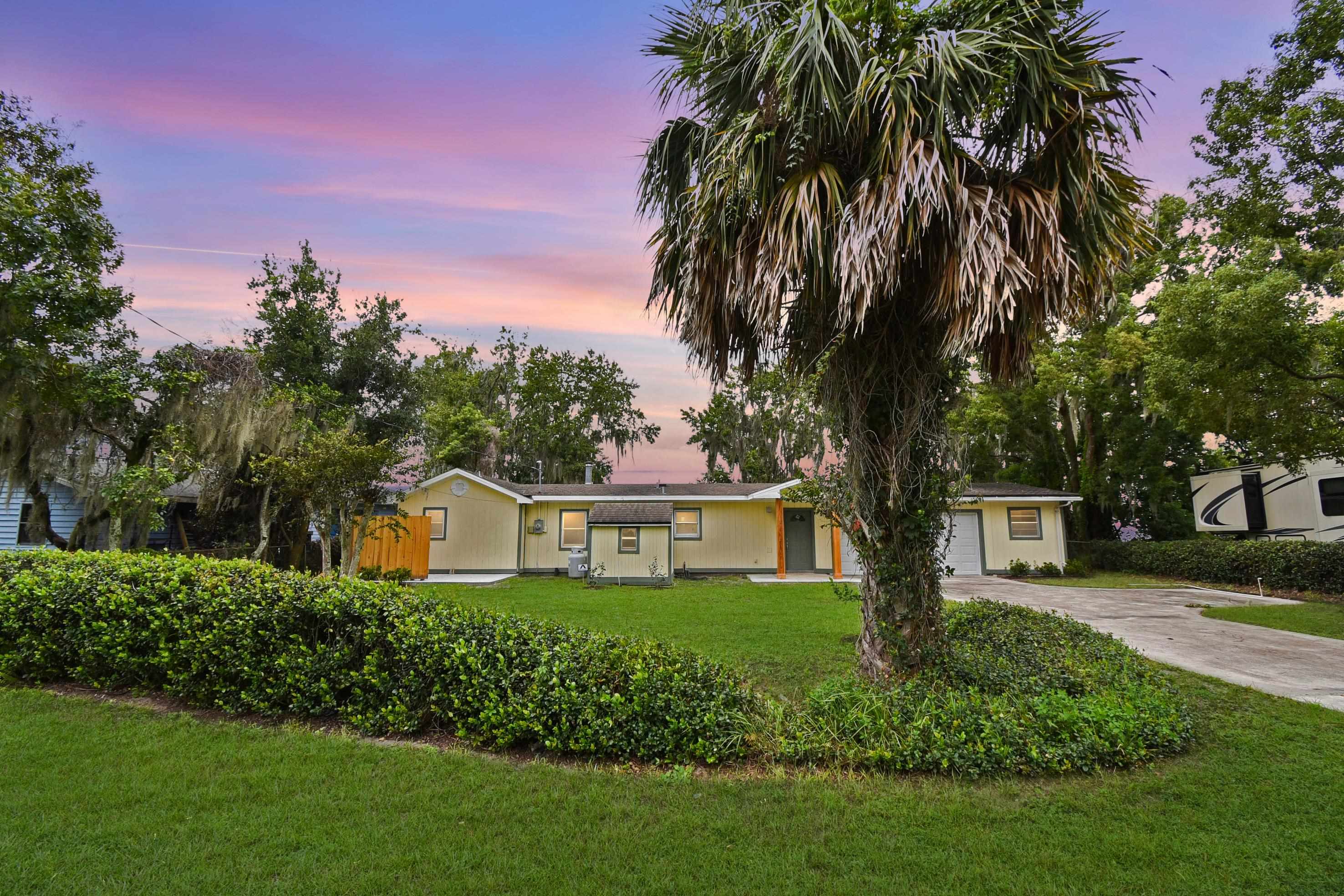 Experience the charm of true waterfront living in this beautifully renovated 2 bedroom, 2 bathroom River Cottage perfectly positioned on the banks of the St. Johns River. With 1,180 square feet of thoughtfully designed living space, this home offers both comfort and character. The newly renovated kitchen and bathrooms feature modern finishes and updated fixtures, creating a fresh and inviting interior that blends seamlessly with the serene surroundings. The spacious primary suite includes a walk-in closet and a private screened-in porch overlooking the river, offering the perfect place to unwind with morning coffee or watch unforgettable sunsets at the end of the day.  The home is complete with all major appliances, including a washer and dryer, and offers a large two-car garage with additional storage space and a dedicated gardening table for outdoor projects or hobbies.