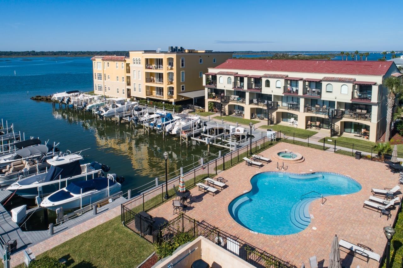 Experience coastal living at its finest in this beautiful fully furnished 2-bedroom, 2.5-bathroom townhome overlooking the intracoastal. Spanning 1,516 sqft, this updated residence features a modern kitchen and bathrooms, ensuring comfort and style.  Enjoy breathtaking views from two private balconies, perfect for relaxing and taking in the serene waterfront atmosphere. With a boat lift that accommodates vessels up to 30ft and 10,000 pounds, this home is ideal for boating enthusiasts.  The property includes water, sewer, and trash in the rent, and the HOA amenities are truly unbeatable. Residents can take advantage of the marina, refreshing pool, hot tub, grilling area, assigned parking, security gate, and community dock.  This home is available for a minimum 7-month lease. Please note, no pets are allowed. Don't miss this opportunity to live in a stunning marina-front townhome! Contact us today to schedule a viewing.  Water, Sewer, and Trash included in rent. NO PETS.