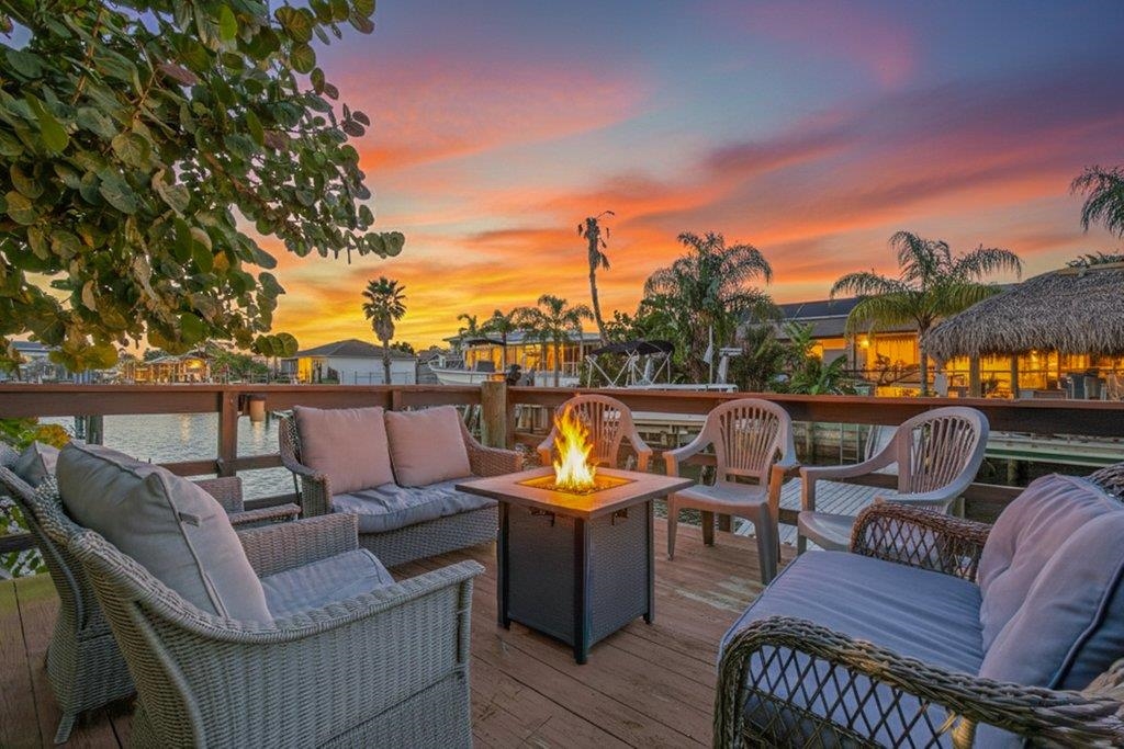 Welcome to this beautifully updated and fully furnished 3-bedroom, 2-bath canal-front home in Treasure Beach, where relaxed waterfront living meets modern comfort. This Turn-Key Vacation Rental property is the ideal investment home OR serene getaway as a second home OR your own full-time coastal residence.  Step inside to find fresh new flooring and paint throughout, creating a bright, clean, and move-in-ready feel. The primary suite is a true retreat, featuring a spa-like bathroom with a stand-alone soaking tub, a spacious walk-in shower, and a large walk-in closet. Two additional bedrooms offer flexibility for guests, family, or a home office. Unwind year-round in the large 10' x 22' Florida room - the perfect space to enjoy peaceful canal views. The Florida Room could easily be added to the air-conditioned space for more room to spread out. The private backyard features sub-tropical landscaping complete with deck overlooking the canal to enoy both the sunrises or sunsets.