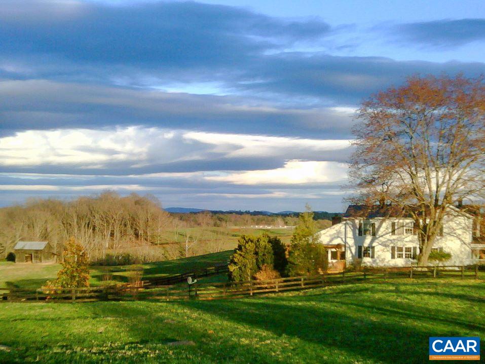 Wildair Farm- A 52 acre farm set in the heart of one of Western Albemarle’s most beautiful pastoral enclaves.  Incredible mountain views in every direction. The rolling mix of productive pasture, towering, mature hardwoods, a bold stream and a large pond offers a diversity rarely found on a farm of this size.  Owners have taken meticulous care of the land and it shows. The charming farmhouse is in good condition as are the numerous farm buildings, riding ring (100 x 200) and fencing. A rare find only 12 miles from Charlottesville and in the heart of Farmington Hunt Country with trails and excellent ride-out.  Farm generates significant income through lease.
