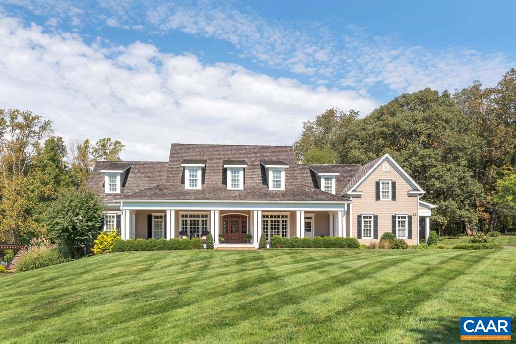 Stunning 5 bed/5.5 bath custom built home on 21+ private acres,(5-6 fenced) Blue Ridge Views, heated salt water pool & spa. First floor owner's suite w/private screen porch, luxurious bath; soaking tub, glass enclosed shower, oversized walk-in closet. Gourmet kitchen w/stainless Wolf & Subzero appliances, center island & large walk-in pantry. Second level w/4 bedrooms (2 ensuites, 2 share jak& jill). Walk-out terrace level offers game room & TV area, bar, kitchen, fullbath, craft room, exercise/gym, lots of storage & workshop area. Treated cedar shake & metal roof, 10'ft ceilings, exposed beams, 3 zone HVAC, generator, 3car garage. A truly magnificent home just 12 minutest from Hollymeade Town Center and 20 minutes to Downtown/UVA.
