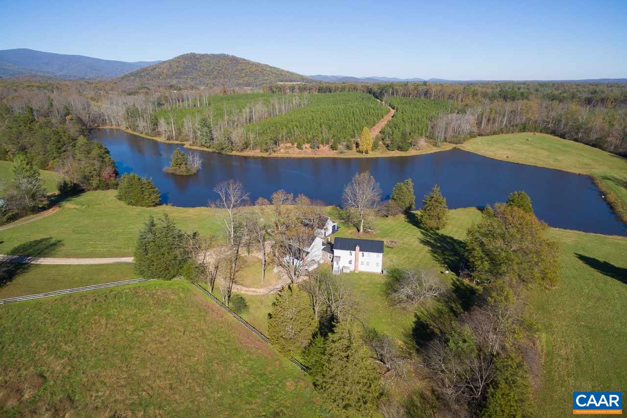 Gorgeous lake and mountain views from 183 scenic acres within 16 miles of Charlottesville. Character-rich, c. 1750's residence of just under 5,000 finished square feet with superb details throughout. 6 bedrooms, 4.5 baths, two fireplaces, whole house generator, and great outdoors spaces. Guest cottage, barn, lush pastures, 11-acre lake.