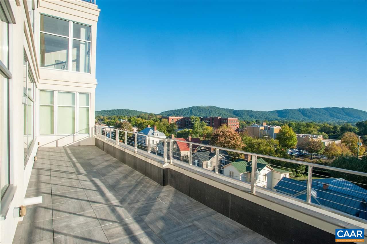 Take in the beautiful view of Downtown Charlottesville and beyond to the Blue Ridge Mountains from the expansive outdoor terrace of unit 605 in The Residences at 218. Ideally situated for serene evenings watching the sunset drop below the mountains. This condo is in “warm white box” condition, and ready to be finished to your particular style and taste. With nearly 3,200 SF of interior space and 400 SF on the terrace, the 270 degree floor-to-ceiling windows offer a unique opportunity to enjoy incredible views from every inch of the condo, including a spectacular southwestern view of the mountains and Wintergreen! This unit is also available as-is and have it completed by your own contractor.