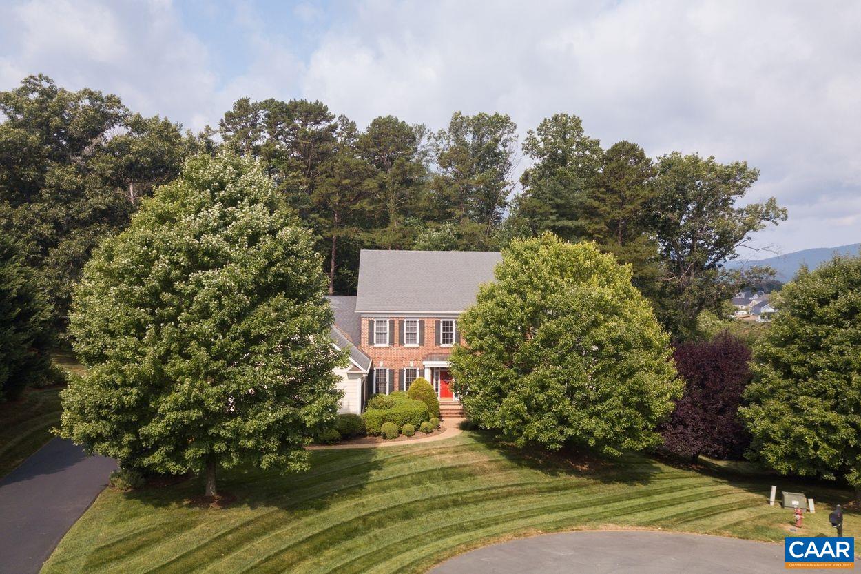 An exceptional opportunity in coveted Foxchase. Featuring gorgeous mountain views and a quiet lot at the end of the cul-de-sac. This property offers endless recreational opportunities through the Home Owners Association which features a pool, clubhouse, walking paths and tennis courts as well as an ideal location near downtown Crozet restaurants and retail. Home highlights include: a functional main floor with all the right spaces for daily living and entertainment, newly renovated kitchen with Quartz counters, a spacious primary suite with vaulted ceilings and newly renovated primary bath, lower level walkout with home theater, wet bar, rec room, putting green, and wine cellar. Located in the Western Albemarle school district.