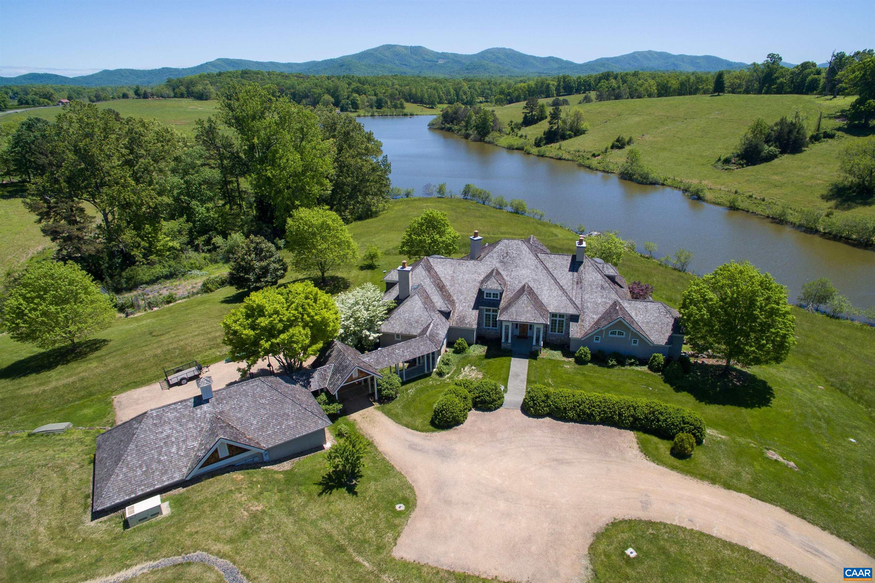 Hard to believe a property with 360 degree views, 15+ acre lake, lush rolling fields of rich grass and a spectacular 5-bedroom home with tall ceilings, heart pine floors, four fireplaces, a study, garages and unparalleled views exists. Located in Greenwood, this exceptional 317-acre property is a gem; a one-of-a-kind, not to be replicated, gem. Add to all mentioned above a handsome log cabin with fireplace, stunning party barn and a two bedroom cottage. Additional acreage available.