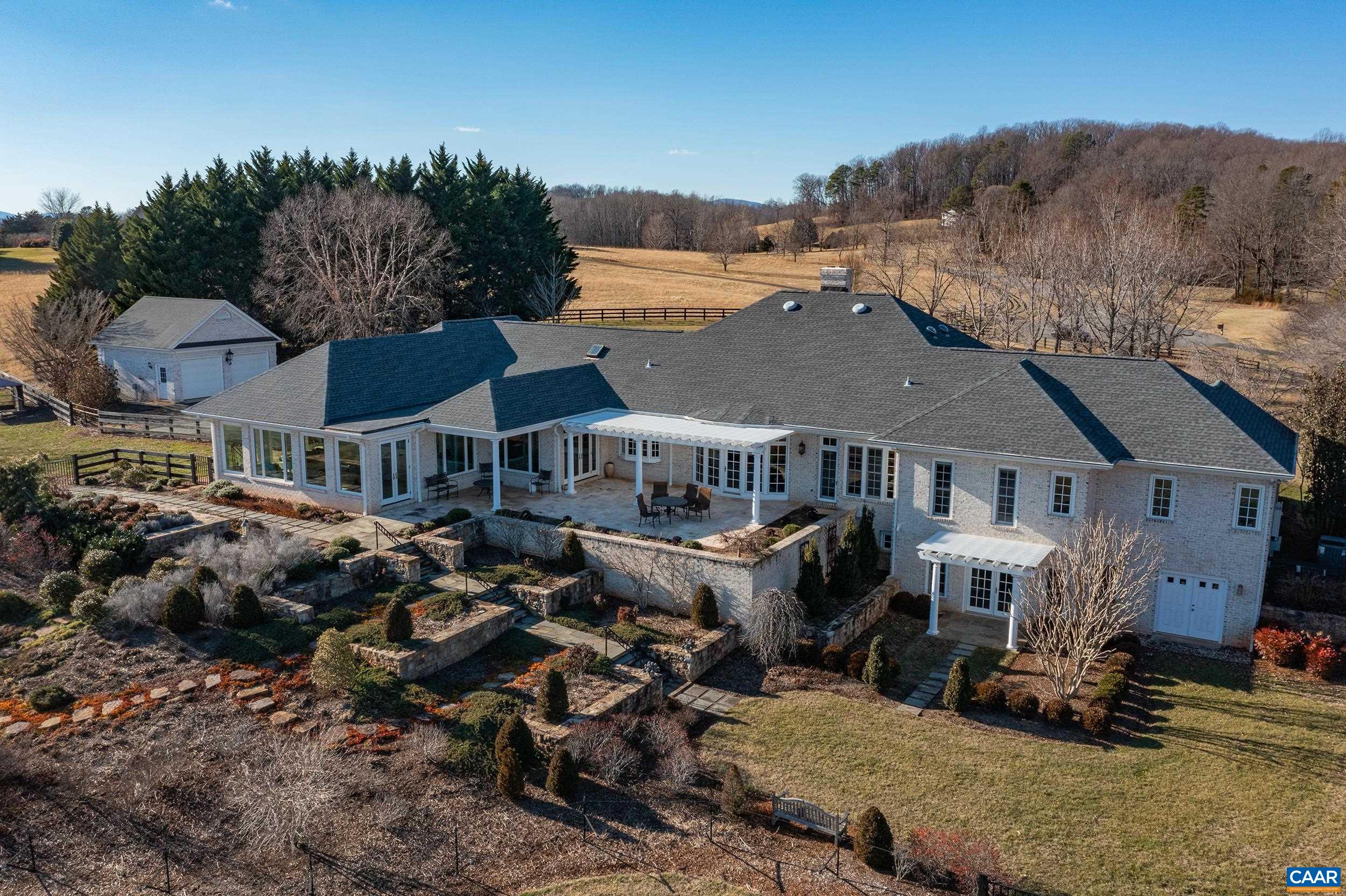 Impeccably designed & custom built Ivy residence situated on over 11 park-like acres, surrounded by mountain & pastoral views, in coveted Blue Springs Farm, only 7 miles west of the University of Virginia & the City of Charlottesville. This magnificent home is in immaculate condition and has been extensively remodeled & expanded upon by the current owner, with great attention to detail & strong craftsmanship around every corner. It boasts a wonderful floor plan with ample space in every room and natural light pouring through every window. Offering nearly 5,500 fin.sq.ft. of living space and 3 or 4 bedrooms - all being ensuite - just some of this home's many features include: a new kitchen with granite countertops & custom cabinetry; stunning new sunroom & breakfast room addition with dramatic views; new back patio/pavilion - perfect for entertaining & relaxation; nearly all newer & upgraded systems throughout; and, so much more! The formal gardens are truly a work of art and an impressive compliment to the rolling & fenced open acreage, which provides a host of opportunities and ways to enjoy. This is an exceptional offering in one of Albemarle County's most desirable areas and school districts.