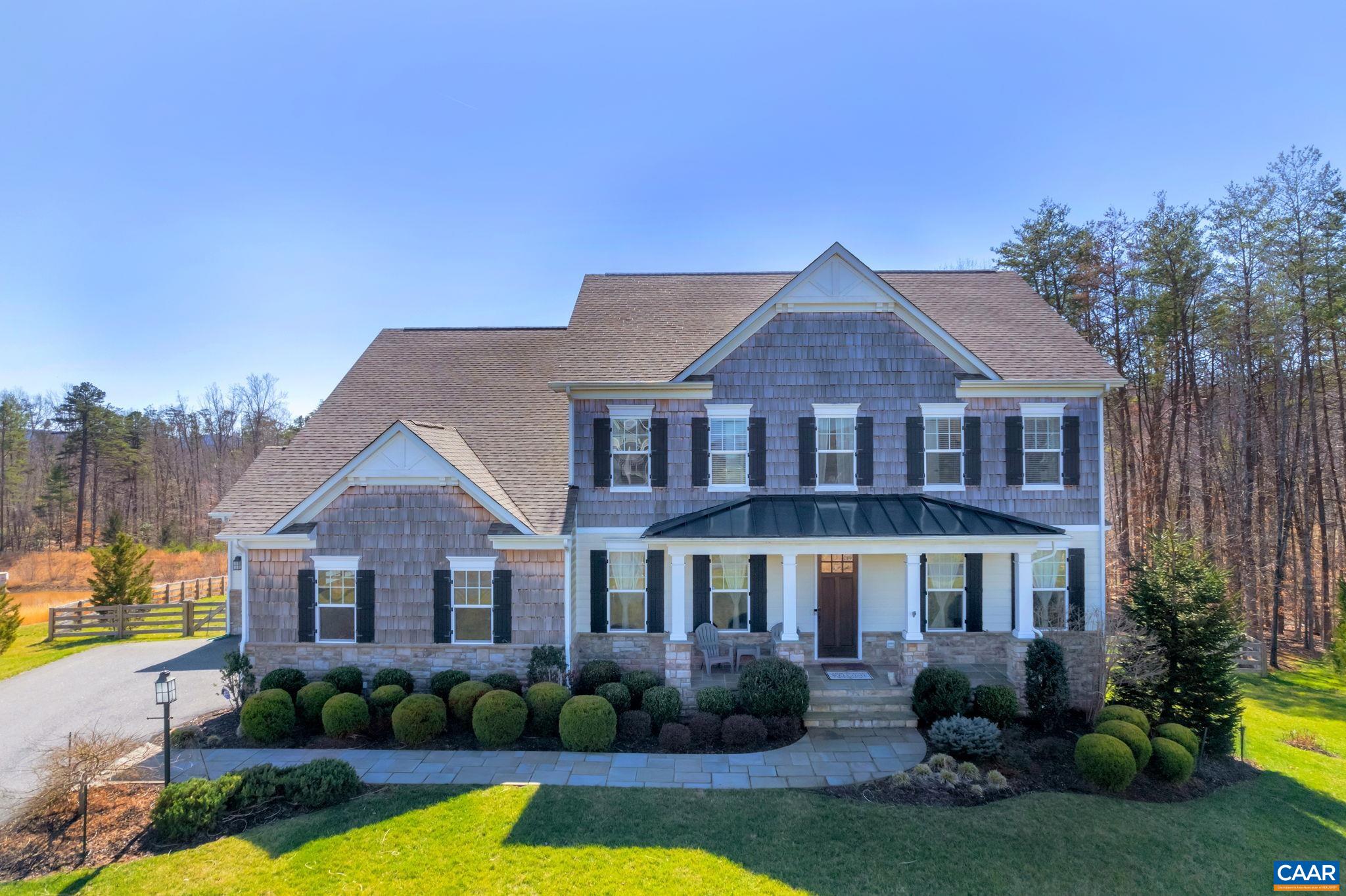 Beautiful, Custom, METICULOUS, home in Whittington, one of Albemarle County's most popular neighborhoods known for its convenience to d'town, UVA, 5th St Station, Shopping and Restaurants, I-64. ELEGANT, Builder Model Home, featured in Parade of Homes. GORGEOUS and RARE Distressed Hickory floors. Modern, highly livable home has well-planned spaces & tasteful finishes. Double Sided Fireplace, Coffered ceiling in great room. Luxurious kitchen features Maple & glass cabinets, wooden pull out shelves, marble counters, exquisite backsplash, double island & stainless appliances, butlers pantry with wine cooler. 2 primary bedroom suites (one on the main level), one upstairs has a Professionally designed closet with marble topped island, pull out shelves and drawers. 2 offices, a total of 5 above-grade bedrooms plus wonderful recreation & 2 separate storage spaces. Sunny walk-out terrace level has on-grade, nearly level fenced yard. Raised vegetable garden w/trellis is served by the irrigation system. This timeless home will delight & impress. Never Dark Whole House Generator. Hardscape Patio has Stacked Stone Gas Fireplace, PRIVATE Screen Porch. See Special Features List in MLS documents