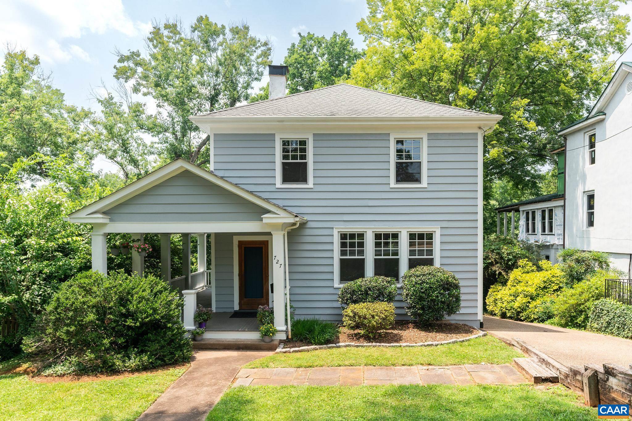 North Downtown Gem! Live your urban dream in this historic home that is walking distance to the Downtown Mall, Ting Pavilion, restaurants and more. The original charm has been preserved in this 1930s home-original hardwood floors, wrap around porch, original hardware-while the essentials have been updated. In the kitchen, granite countertops, cherry cabinets, heated tile floors, vaulted ceilings and skylights were added for beauty and function. The main floor features a large living room with generous windows, formal dining, mudroom, half bath, kitchen and eat in dining. The 4 bedrooms with 2.5 baths with an additional living space in the walk out basement make this an attractive home for any season of life. Enjoy the screened in porch off of the kitchen overlooking the private backyard oasis. Don't miss the opportunity to live on one of the most beautiful and desirable streets in Charlottesville!