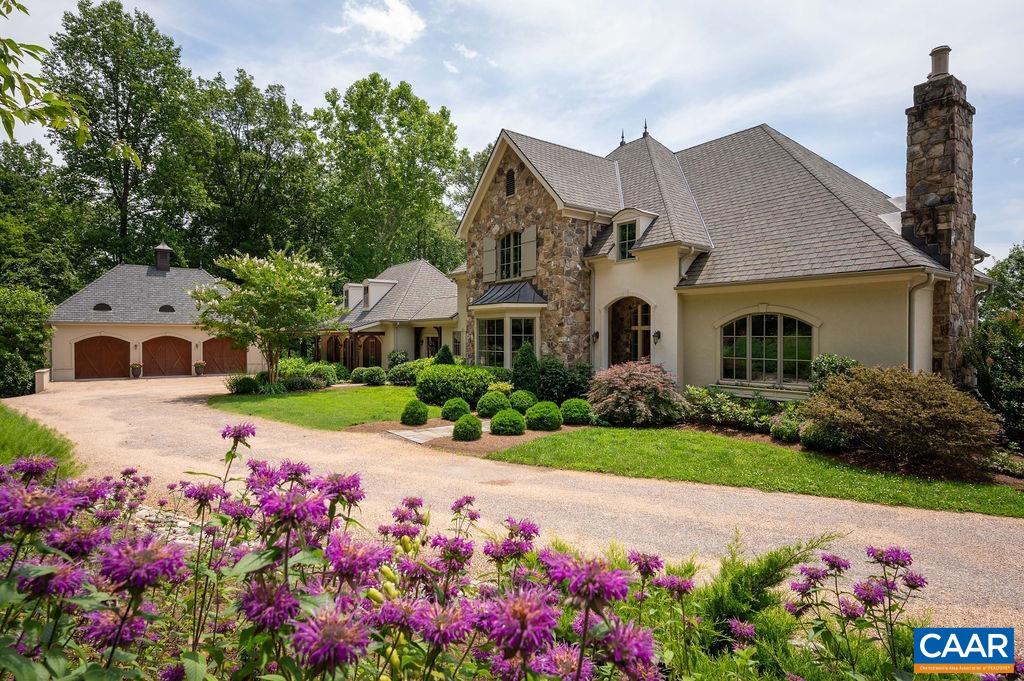 A well-appointed estate on 21 private acres with mountain views in sought after, park-like Blandemar Farm. An architecturally designed European style stone and stucco residence custom built using the best in materials and finishes. This five bedroom, five and a half bath home features a first-floor primary bedroom suite, a gracious family room with 24-foot-high ceiling and brilliant natural light, handsome living and dining rooms, gourmet kitchen, and a fantastic addition complete with separate entrance, kitchenette, office, den, bedroom, and full bath. The second floor showcases three substantial bedrooms each with ensuite bath, and a distinctive bonus room above the addition. The unfinished basement enjoys 2,800+ square feet with an outside entrance. Enjoy the views from the screened porch, bluestone patio, or while walking the landscaped grounds less than 15 minutes south of Charlottesville.