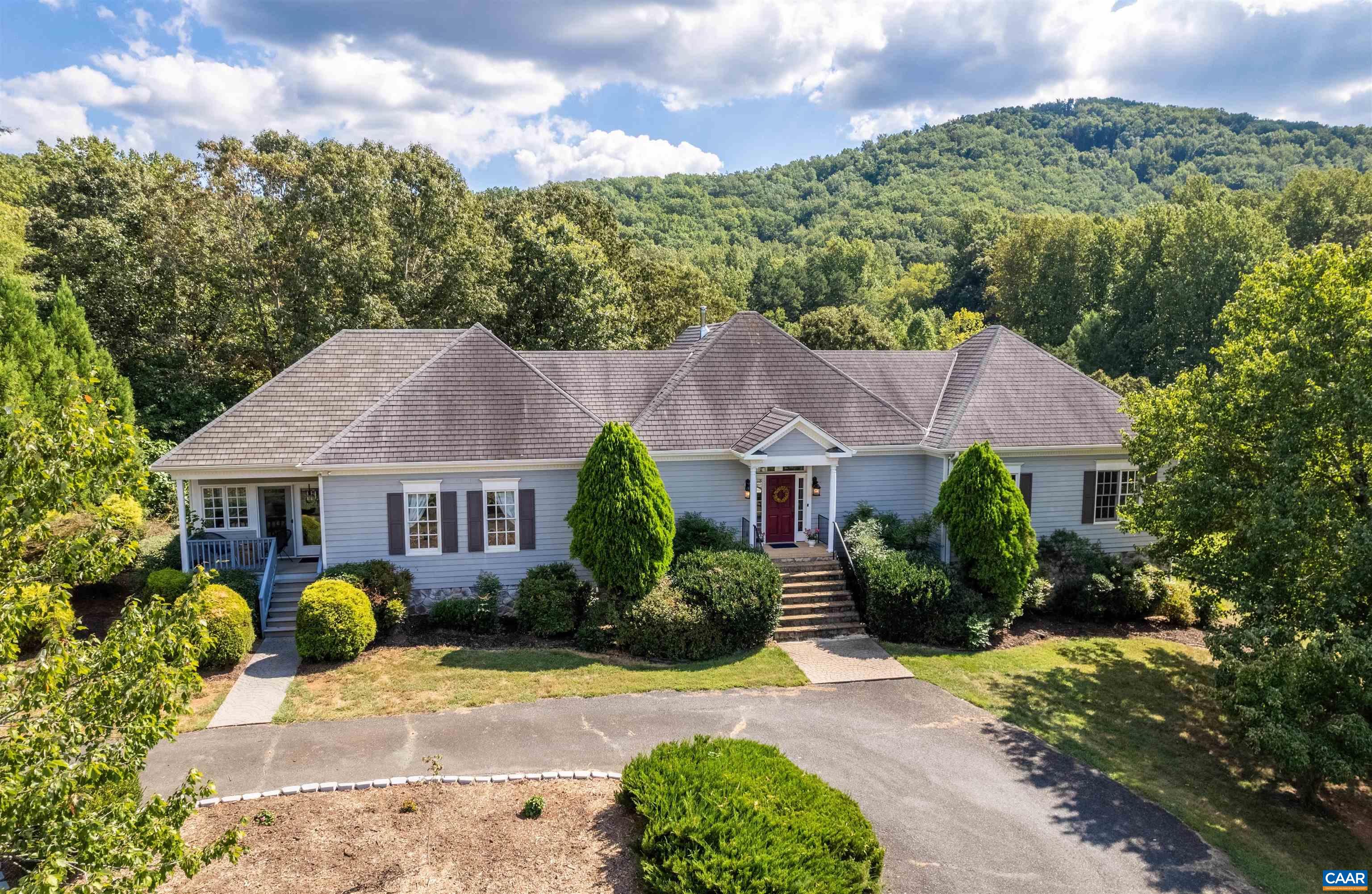 OPEN HOUSE, Sunday, 9/24, 1:00-3:00. Country living at its best just down the road from the delightful Batesville Market in the quaint historic village and minutes from Crozet shopping, schools & restaurants. Builder's own custom built home w/ one level living has been updated & improved in recent years. Features include: main level owner's suite, finished terrace level, detached studio/office, lovely gardens & chicken coop, just to name a few! Gorgeous hardwood floors, extensive moldings & thoughtful details throughout. The central great room has wood burning FP w/ slate surround. Gourmet kitchen features white cabinets, granite countertops & stainless appliances. Light-filled sunroom & huge screened porch w/ stunning mountain views perfect for entertaining or relaxing w/ your favorite book. The spacious owner's suite offers private ensuite bathroom and walk-in closet. Two additional bedrooms and a full bath on the main level. Terrace level is finished and features a huge rec room w/ custom built-ins & luxury vinyl flooring that leads to two additional bedrooms & full bath, plus laundry and oversized 2 car garage w/ tons of storage. 3rd garage space is attached to the separate studio/cottage.