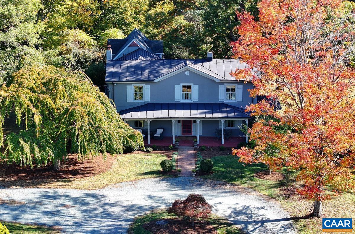 A Virginia farmhouse, built in 1910, secluded away on almost Five Acres in the heart of Crozet. Carefully restored and expanded by Designers and Craftsmen over the course of more than 20 years, the intention on interior detail and exterior proportion arrest the visitor in ways similar to the Mountain Views found from the property. With open yards and cross fencing, mature trees, multiple structures for storage, and a custom built barn, the property is only a minute or two from King Family Vineyards, and Downtown Crozet.  Inside the Residence, heart pine and hardwood run the floors of the farmhouse. While the first floor of the addition features one of Karen Turner's original kitchen designs. On the second floor is a full master suite with walk in closet. The house is wired with fiber internet.