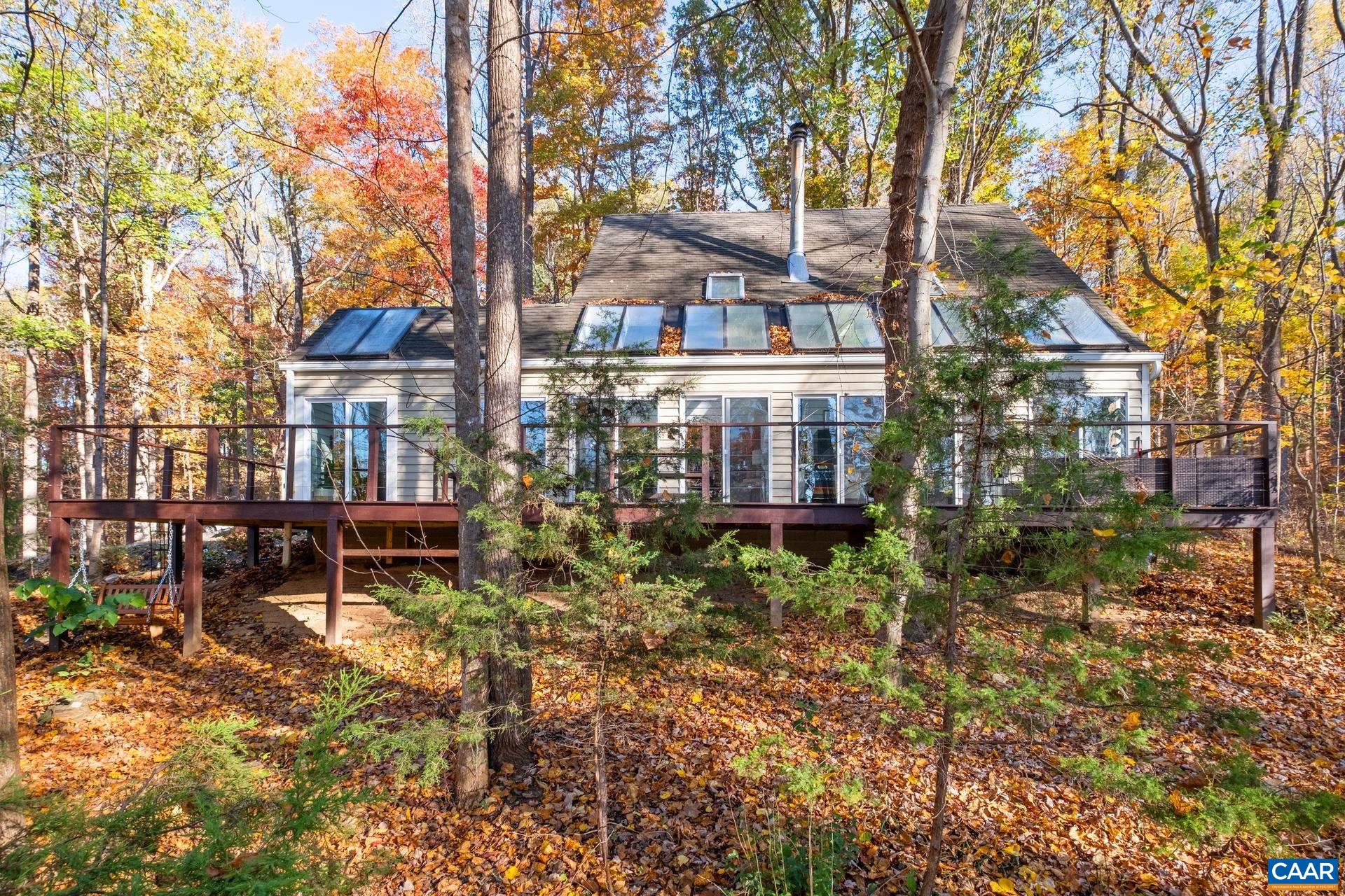 Stunning renovation of an award winning home in the coveted community of Peacock Hill. You will love every detail of this beautifully designed mid-century modern retreat. Featuring an open floor plan with cozy spaces throughout. The kitchen is spacious and elegant. The sunroom overlooks a stunning deck and out into the trees and winter mountain views. There are hidden gems throughout this property - New flooring, new HVAC, tastefully renovated bathrooms, newly added covered porch and entry foyer. Escape to the detached studio or the cozy finished attic space or relax by the wood stove. You have to come and experience this one for yourself!