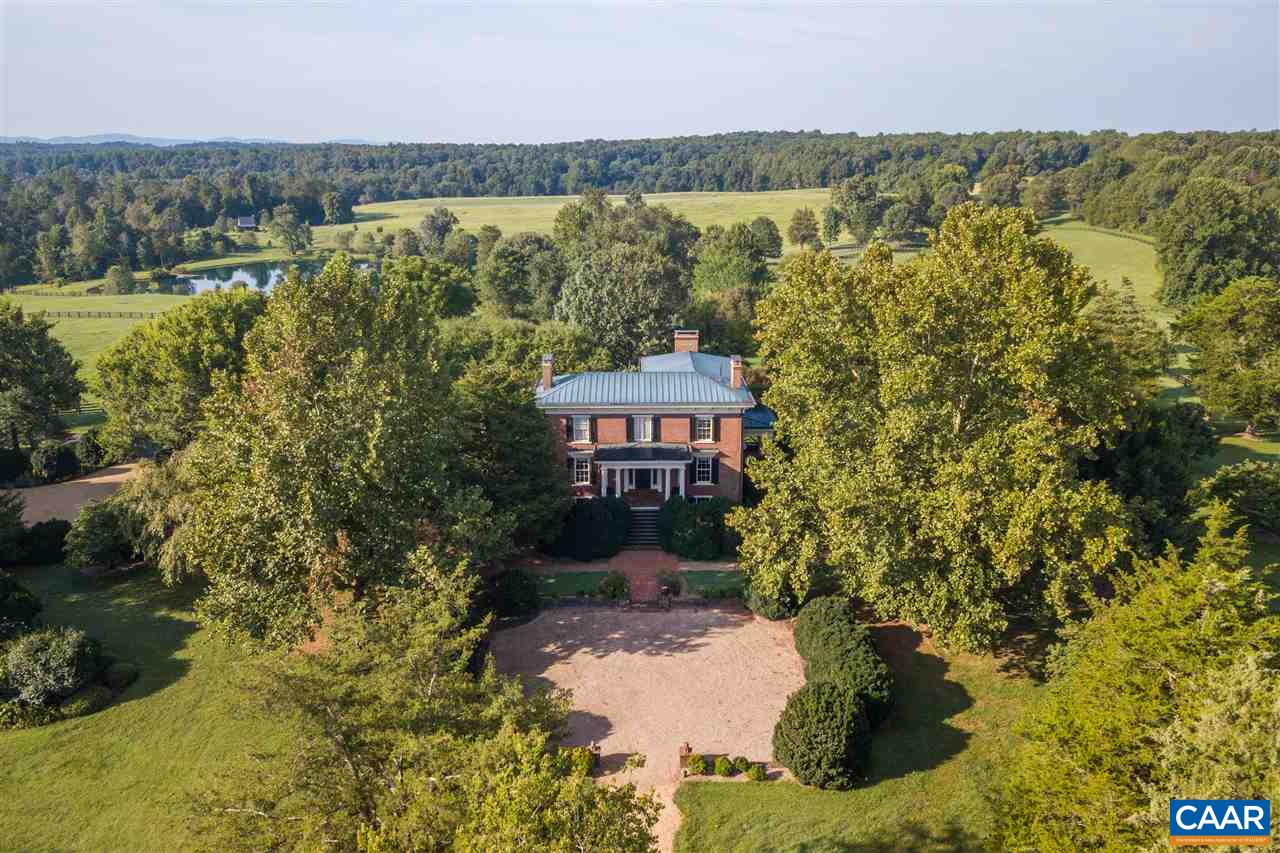 This expansive estate, tailored for the Virginia Sportsman, unfolds across 510 acres of landscapes, featuring a mix of wooded areas, open pastures, and multiple ponds. Meticulously preserved through the centuries, the Georgian-style manor home from the 1830s and 1840s stands as an exemplary testament to the craftsmanship of bygone eras, showcasing enduring care and attention to detail.  Complementing the estate are accessory buildings, including a pool and pool house with a library and guest accommodations. A carriage house/garage with a two-bedroom apartment and a cabin overlooking the pond.  Additionally, a variety of barns, garages, and other supporting structures contribute to the property's versatility. The potential for an events venue caters to those who wish to entertain, while the 500-yard rifle range appeals to those who wish to hone their marksmanship.   Conveniently located just 15 miles north of Charlottesville, this estate offers a serene retreat in the heart of rural Virginia, making it an ideal haven for the discerning Virginia Sportsman.