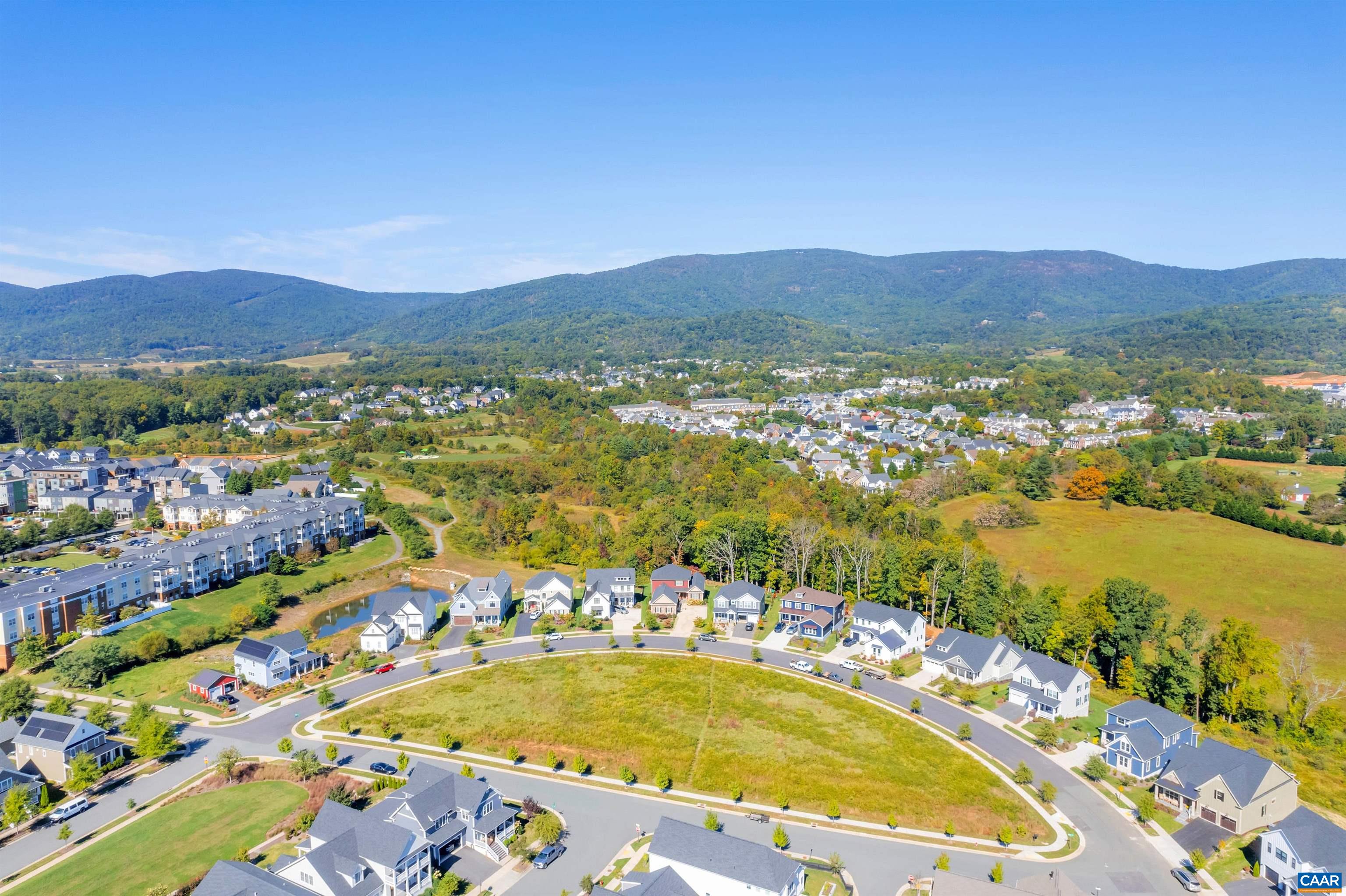 Luxury Elevator Townhome with Mountain Views! This End Unit Towne comes with 4 Finished Floors, Residential Elevator servicing all 4 Floors, Rooftop Veranda and potential rental income with 1st Floor Bedroom/Bath dependency/ADU. This wide townhome is designed to capture the beautiful Crozet views while incorporating thoughtful, included features and spacious living spaces throughout. Starting with a 2-Car Garage, finished bedroom and full bath dependency/ADU on the lower level, you can head to the open 2nd Level for entertaining in your Kitchen, Great Room, Dining Room & spacious Trex Deck (plus a half bath!). The 3rd Level is home to the private Owner's Suite & Bath, second bedroom and full bath. The 4th Level comes with a finished Rec Room, full bath & show-stopping Veranda. Located in amenity-filled Old Trail, you can enjoy all that this neighborhood & Crozet have to offer! You'll get to work alongside our talented Design Coordinator to hand pick all the selections, truly making this home your own. Start planning for your Fall 2024 move-in now! End unit. Elevator and Veranda Included.