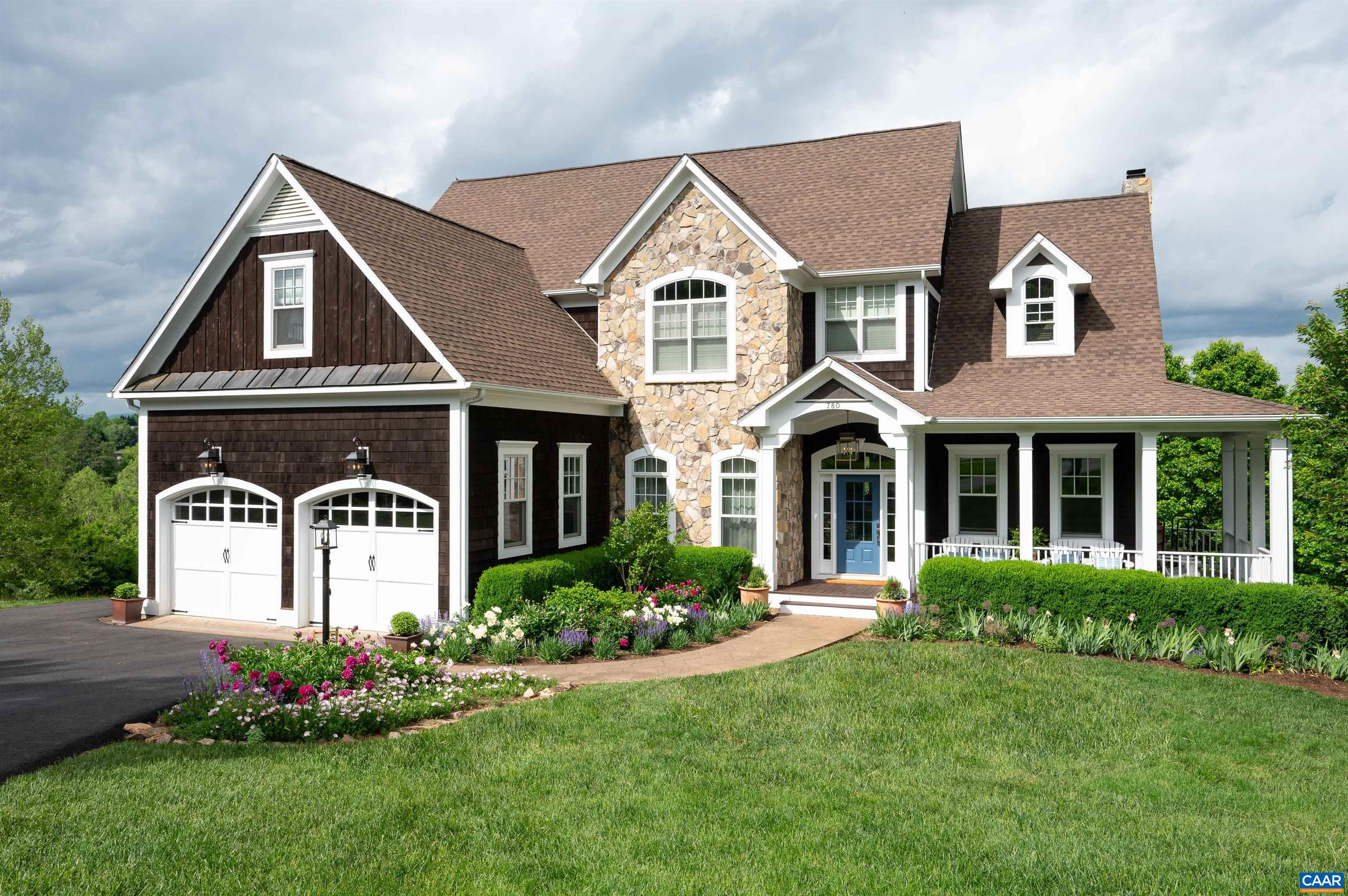This stunning 5BR/5.5BA custom-built home w/ over 5,400 finished sq. ft. of living space throughout 3 levels - situated on a beautiful lot at the end of a cul-de-sac - offering gorgeous mountain & panoramic views - is truly a special offering! This impressive & well-built home has been thoughtfully improved by the current owners and features an array of quality craftsmanship & detail around every corner. Main level is filled w/ natural light and some of the many features include: spacious living room w/ stone wood-burning fireplace joining fully loaded eat-in kitchen w/ granite countertops, stainless steel appliances & dining area w/ access to one of two rear decks; formal dining room w/ tray ceiling; spacious master suite & recently renovated bath w/ dual vanities, soaking tub & heated floors. Upstairs boasts 3 bedrooms, 3 full baths & bonus room. Basement level is massive and features a second kitchen, family room w/ stone fireplace and walks out to a huge deck - perfect for entertainment. Located within the coveted Foxchase neighborhood of Crozet - all of the town's amenities are just a short drive away, and City of Charlottesville & UVA are only 10 miles east. The scenic lot backs up to Lickinghole Creek & neighborhood trails!