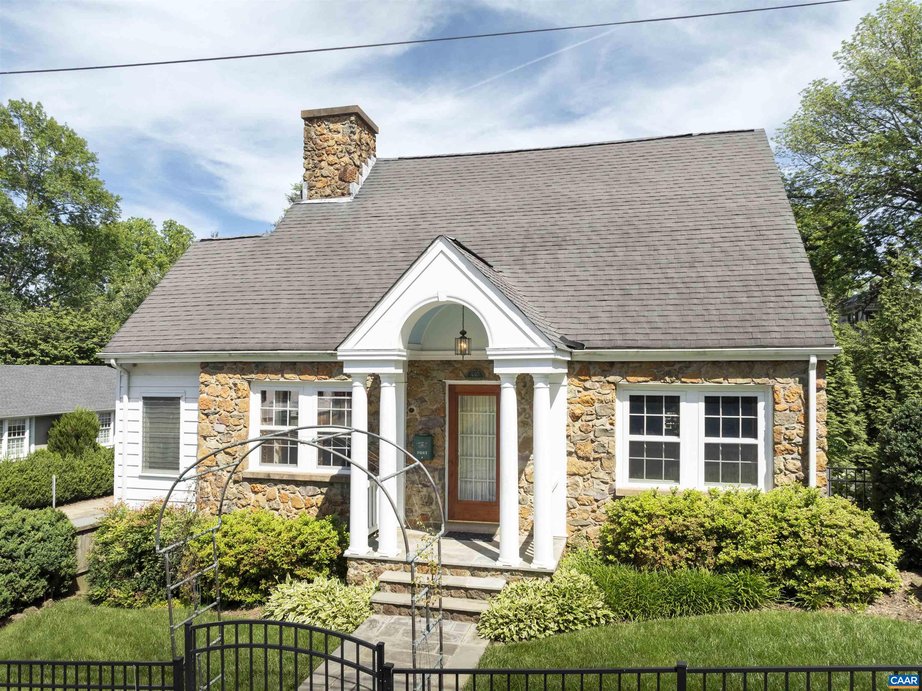 Quintessential, rare stone cottage in the heart of downtown. One of the few stone cottages that adorn Charlottesville. Beautiful property on a corner lot, steps from the downtown mall. Gorgeous exposed stone highlighted throughout the home, even in the basement & garage. This inviting home melds together convenient city living with the feeling of being in quaint countryside. The private garden is a picturesque and fragrant oasis, filled with the scent of gardenias and surrounded with lush greenery, curated trees and plants. Schedule a viewing today!