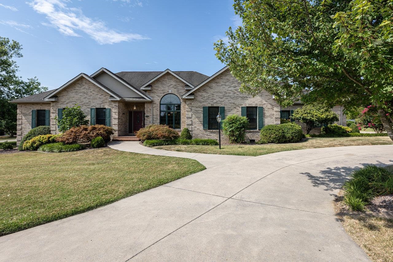 Welcome to this stunning brick home, where architectural elegance & one-level living come together in perfect harmony. The meticulously designed layout showcases elegant angles & an open concept, providing a seamless flow throughout the home.  The gourmet kitchen features a remarkable 16' island with quartz countertop, custom solid wood cabinets & ample seating; ideal for both casual dining & entertaining. Hardwood floors & triple crown molding add a touch of sophistication while the dining area boasts a 12'10" ceiling that showcases an impressive 9'6" Palladium window.  Relax & unwind in the sunroom, complete with a mini-split system for year-round comfort, or enjoy the sauna for the ultimate relaxation experience. The home's efficient 3-zone HVAC system ensures personalized climate control throughout.  Step outside to your private oasis featuring an in-ground swimming pool & fenced-in backyard, perfect for outdoor gatherings & serene relaxation. With abundant storage options, including ample attic space & expansive garage w/workshop, this home effortlessly meets all your storage needs.  Experience the perfect blend of modern convenience & timeless elegance. Don’t miss the opportunity to make this exquisite home yours.