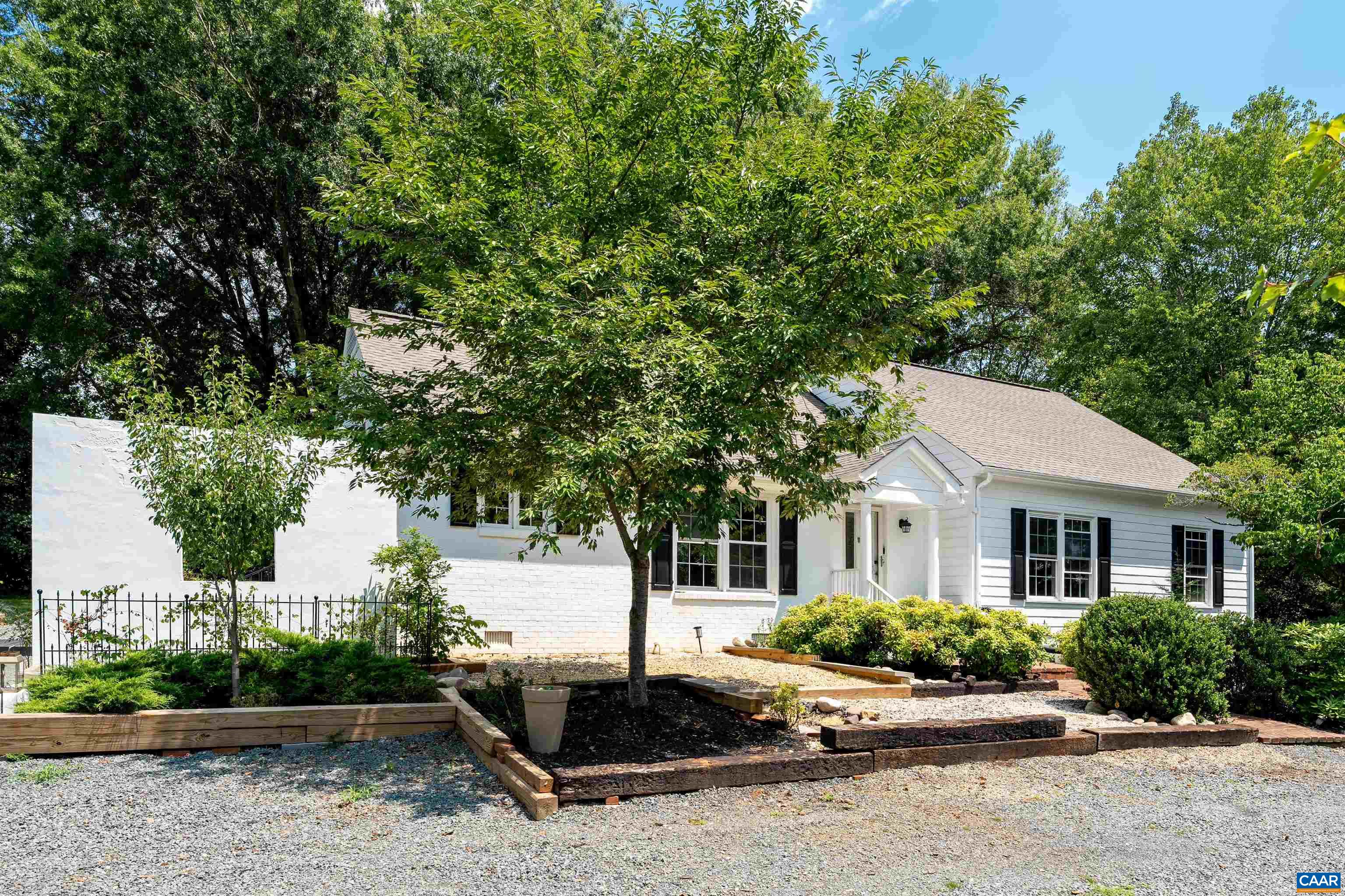CONTEMPORARY 4BR & 3BA COLONIAL LOCATED IN THE HEART OF IVY ON 2+ PICTURESQUE ACRES. Owned and cared for by renowned filmmaker Eduardo Montes-Bradley, this home provides a unique open concept, perfect for living and entertaining. The main floor provides gorgeous reclaimed hardwood flooring from the Girls Dormitory at the old Farmville Female College, which was Virginia’s first public institution of higher education for women when it opened in 1884. The charming front entry door is from the DuPont Mansion, when it was renovated by James Madison's Montpelier Foundation. The side kitchen door was recovered from the Old Baptist Church in Luray, and leads to a side patio with gardens. Centered on the main level is a beautiful gas fireplace, which provides a unique flow from the kitchen and dining room into the living rooms. The kitchen boasts stainless steel appliances and soapstone countertops, and prominent windows create a light-filled living space. Explore 2.26 acres of usable land with an abundance of opportunity. Enjoy all the conveniences of living on Owensville Road in sought-after Western Albemarle. Walk to Ivy Elementary, Blue Ridge Swim Club and Duners. Only 15 minutes to UVA and Downtown Charlottesville.