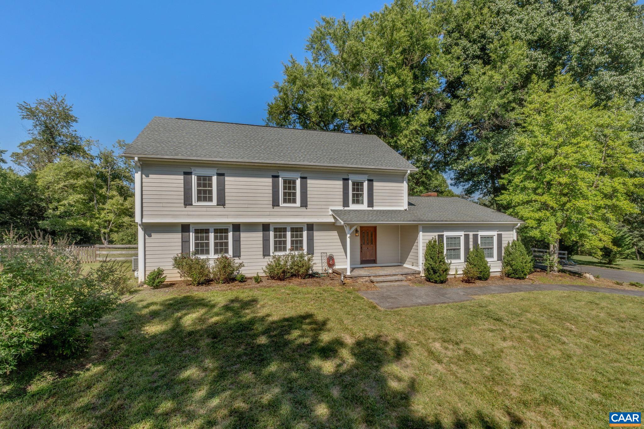 Charming home in Ivy's West Leigh neighborhood on a nearly 2-acre picturesque lot! This home ticks all of the boxes with 4 bedrooms, 2.5 baths, gracious living areas, a finished basement, large garage, storage shed w/ electricity, and a fenced-in yard on a quiet street in a coveted neighborhood. The main level includes two large living areas and a tucked-away office space. The kitchen, with a great view of the backyard, was recently renovated to include painted cabinetry, quartz countertops, and a custom hood over the range. The sunroom off of the kitchen, with new windows, is a perfect gathering space to entertain or enjoy time with friends and family. Upstairs, the secondary bedrooms enjoy access to a large hall bathroom with fantastic storage. The generous primary bedroom features an elegant walk-in closet and tranquil en suite with custom tile work. The expansive front lawn and private, fenced-in backyard are both flat and easy to access -- great spaces for recreation, gardening, outdoor entertaining. There is so much to love about this home with lots of updates and plenty of opportunity to make your own. A must see!