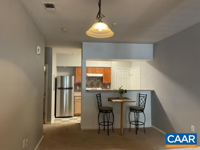 Enjoy easy living with first floor access.  Condo includes ample storage with large closet, storage room, and pantry.  Private patio.  Popular Carriage Hill Community HOA amenities include: clubhouse, pool, hot tub, game room, fitness center,  business center, tennis, tot lots, dog park, and more. Easy access to all of Charlottesville via 250 or I-64.  Near shopping and Sentara Hospital. New range and refrigerator!