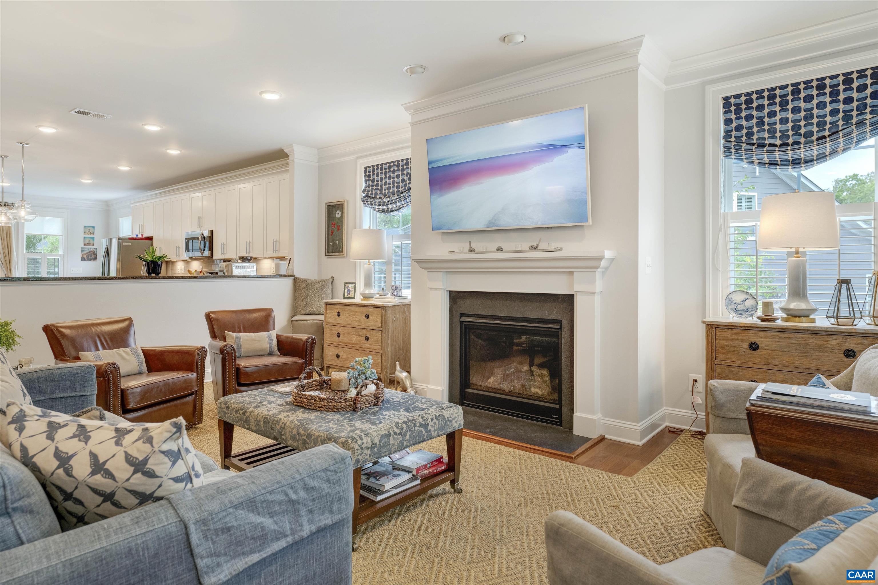 Beautiful, light-filled end unit townhome in the coveted Villas at Belvedere neighborhood. With 9' ceilings, fireplace, and elegant trim work, the spacious great room flows right into a massive kitchen with granite counters and a large island designed for entertaining. Out back the screened-in porch and patio offer outdoor comfort and privacy, and the large garage easily fits two vehicles. Spacious first-floor master suite (full ensuite bath and walk-in closet) along with hallway powder room for visitors. Upstairs boasts two more bedrooms and full bath next to a large open living space easily utilized as a den, home office, or TV room. Adjacent is a massive storage room for all that extra stuff! This two-story townhome is incredibly well-built and has been meticulously cared for. This one won't last long!