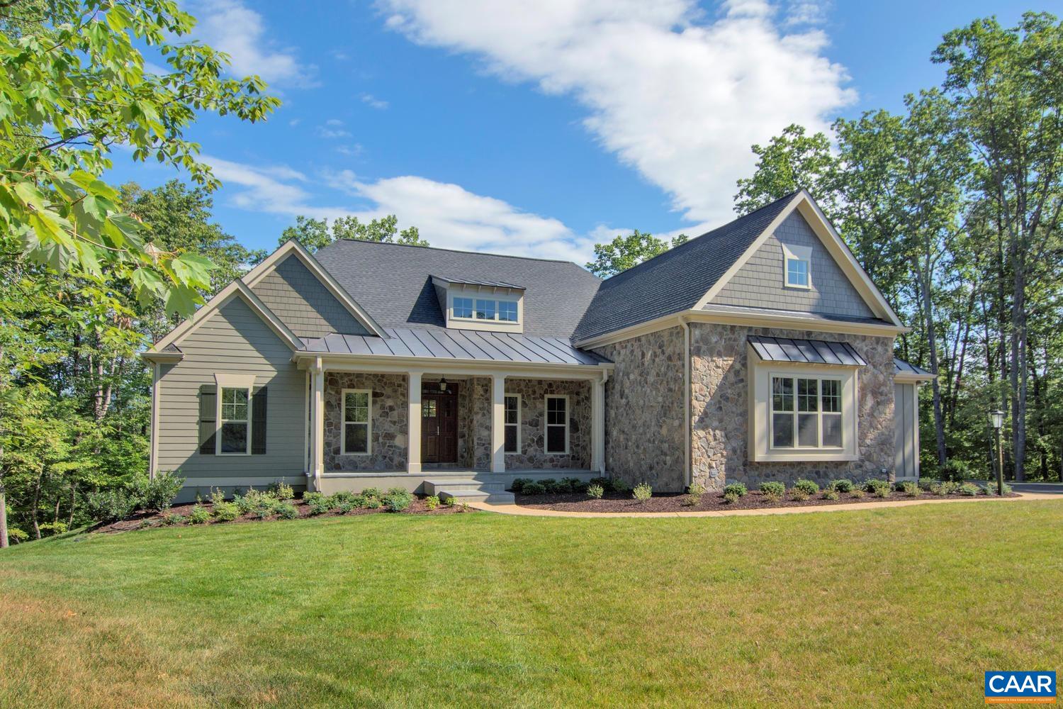 Pre-Sale Newport with August 2025 Closing. Unique offering in this premier, established community on a wooded, 5 acre homesite, convenient to UVA and downtown. This ‘Newport’ plan offers an open floorplan with a stunning Great Room that boasts a cathedral ceiling and tons of windows to maximize natural light. Walkout basement with finished basement recreation room & full bath included. Quality built 2×6 exterior walls, custom mahogany front door, R-19 insulation, and standing seam metal roof. Kitchen includes painted maple cabinetry (white, gray, etc. shaker style), granite countertops (also in primary suite), and much more. Photos are of previously built model home. New Construction with no construction loan needed– with deposit Builder will fund the build so that purchaser may obtain the same type of loan as if they bought a resale. Builder also offers a streamlined process to make planning your move easy with a known move in date upfront. On-staff draftsman for plan customizations.