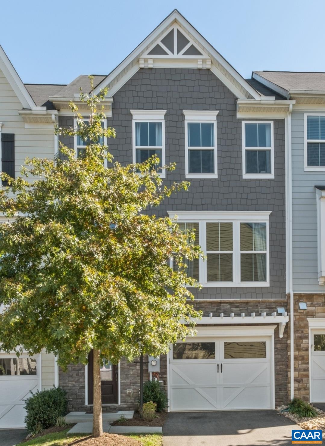 OPEN HOUSE: Sunday, 2/2, 1:00-3:00! Enjoy your panoramic view of Carter Mountain from your private roof top terrace! This beautiful home has exclusive upgrades only found in this house. As you enter the house you are greeted in a light filled foyer. The bottom floor has a great multi-purpose room which can be an additional large family/recreation room or guest suite with attached bath. The sliding door opens to your patio & fenced yard. Upstairs you find the open floorplan including your living room, dining room & upgraded gourmet kitchen with oversized island. Perfect for entertaining inside & out with a large deck perfect for a BBQ. From there, head up to the bedroom level. There you'll find a large primary suite with two closets & master bathroom with double vanities. Two more bedrooms, bathroom, & laundry complete that level. From there you get to enjoy your loft which makes a perfect home office or hobby space along with the roof top balcony. Great location minutes from UVA, Downtown, Wegmans, I-64, and the new Biscuit Run State Park. The Avinity neighborhood is a true community where neighbors know each other. Enjoy the dog park, clubhouse, playground & full gym or meet neighbors at a wine social or the weekly food trucks.