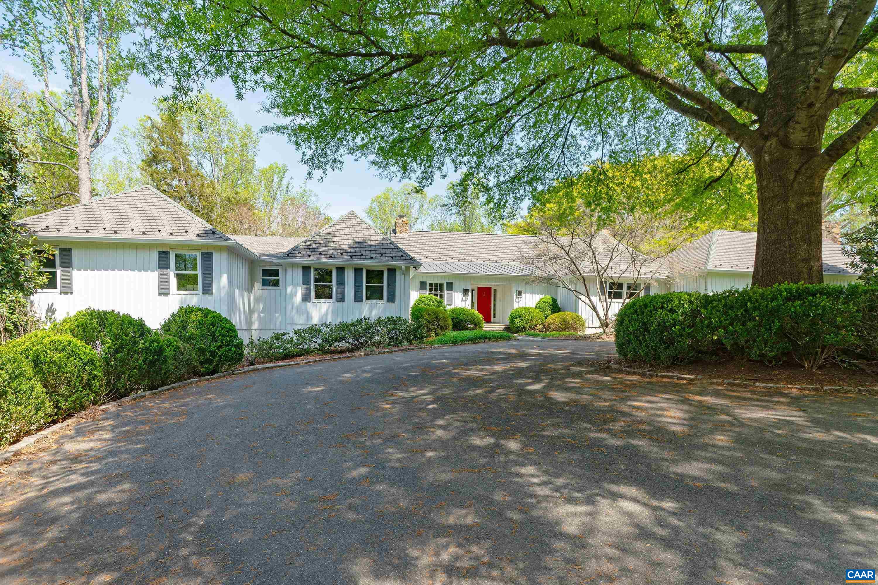 Remarkable & unique 4 bedroom, 5.5 bath, one story residence with a beautifully designed floor plan nestled on a wooded drive and elevated 2.2 acres within the renowned & luxurious confines of Farmington Country Club. Spacious rooms, high ceilings, huge windows, quality finishes, hardwood floors, outstanding flow and charm are just several of the cornerstones that define this lovely home. With over 5,800 finished square feet of living space, there is no shortage of inviting spaces to enjoy and live comfortably. Living room boasts an absolutely stunning stone fireplace built by Sheldon Sprouse - an acclaimed local stone mason. The dining room, family room and library are all well proportioned, have their own handsome fireplaces and spill out to a private stone patio - a perfect spot to entertain. Fully equipped kitchen with stainless steel appliances has an adjoining breakfast room, butlers pantry and additional walk-in pantry. All bedrooms are en-suite, including the primary suite with vaulted ceiling and an attached fully outfitted marble-tiled bath, plus massive closet. The lot has been gorgeously landscaped, offering delightful spaces for relaxation & pursuit, and possesses a most impressive Willow Oak and other specimens.