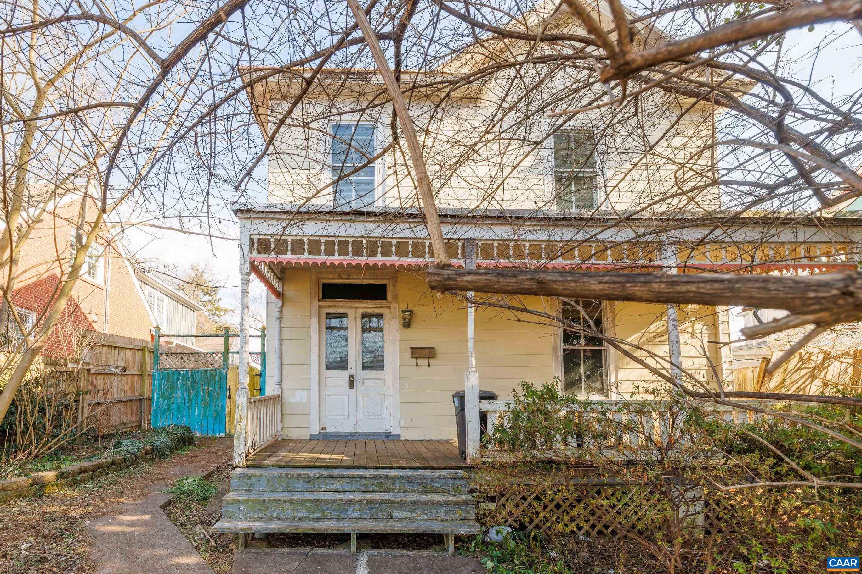 JUST LISTED! Historic Craftsman in Downtown Charlottesville – A Visionary’s Dream! Located in the highly sought-after Martha Jefferson neighborhood of Downtown Charlottesville with alley access, this historic Craftsman-style home is waiting to be reimagined! Just moments from restaurants, live music, coffee shops, and all the charm of downtown, this property is an incredible opportunity for those looking to create something special. Step inside to find soaring 10’ ceilings (remove paneling with potential for even more height!), grand foyer, expansive room sizes, solid hardwood floors and vintage sliding doors that once led to a parlor—a true nod to its historic character. The home also boasts a metal roof, a welcoming front porch, and a yard that was once fully fenced (partially fenced now) for added privacy. With tons of off-street parking via alley access and space to build your own garage, the potential here is endless! This property needs a total remodel, and the seller has no knowledge of its condition—bring your vision and your offers! Location. Character. Unlimited Possibilities. Don’t miss your chance to transform this historic gem! Sold as is.