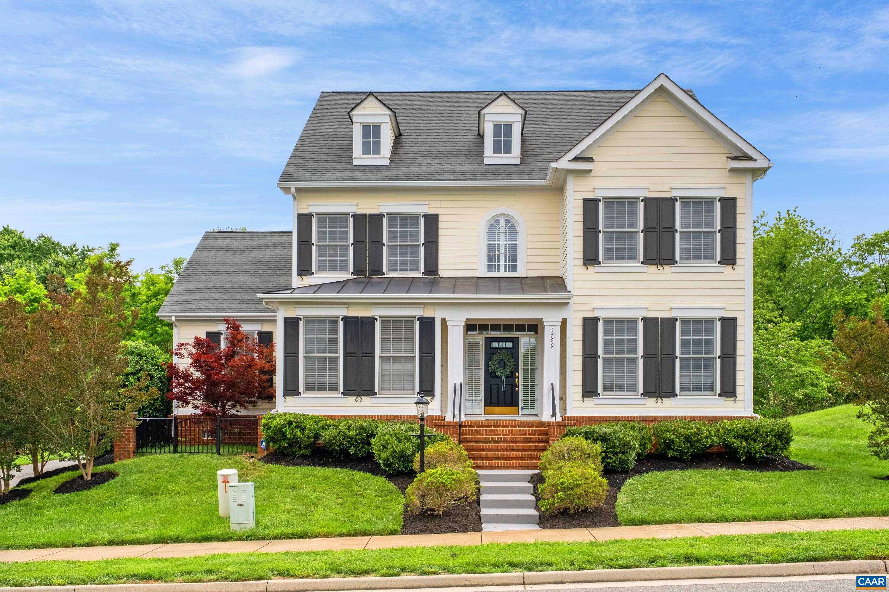 Beautiful home set in desirable Old Trail Village surrounded with Blue Ridge Mountain views & impeccably maintained. Main-level primary suite with two walk-in closets and plenty of room to relax in the ensuite which offers a garden tub for soaking, separate walk-in shower, & generous dual vanity with room for pampering. Chefs will enjoy cooking & entertaining in the upgraded gourmet kitchen with KitchenAid stainless-steel appliance suite, breakfast bar, polished white tile backsplash, granite counters, ample cabinetry plus two pantries & the eat-in area opens to lovely living room featuring built-in shelving & cozy fireplace overlooking the yard. This home boasts a five-bedroom layout plus an office! As you enter, you will be greeted by soaring ceilings, hardwood flooring and a grand staircase leading to four generously-sized secondary rooms on second level. Sip a nice drink on the new low-maintenance composite deck. Spacious rear garage enters through mudroom & laundry room area. Enjoy the walking/ biking trails, parks. Easily access Old Trail Club's 18-hole Golf course & Pool. Conveniently located, close to vineyards or walk to downtown.