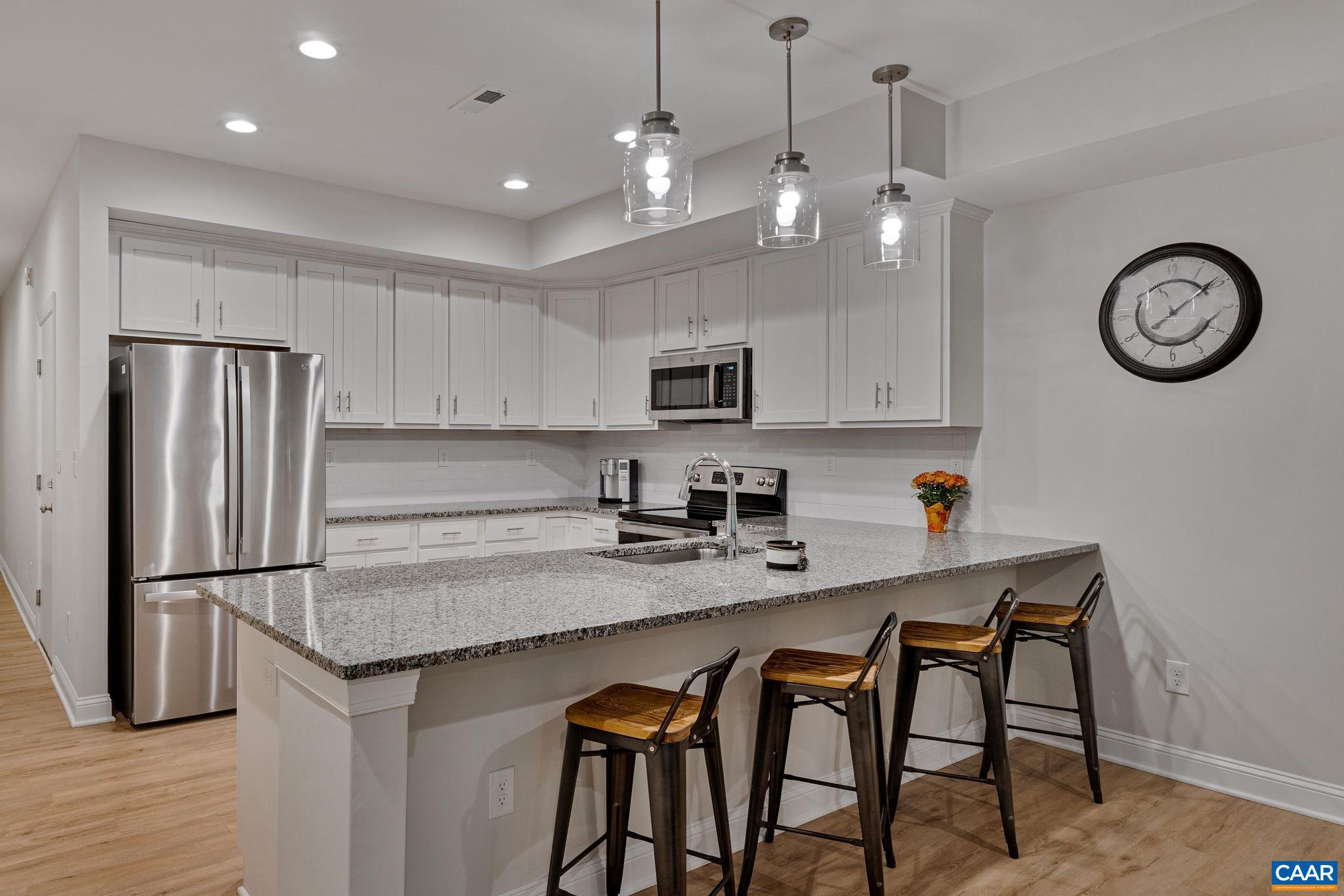 Wow! Priced at assessment and not your cookie cutter townhouse community. Pristine and immaculate, this beautifully cared for townhome on a quiet cul-de-sac shouts perfection from every corner. Built in 2022, you'll think you are walking into a model home! Birnam Wood is a special community - centrally located to UVA, Trader Joe's, Barracks Rd Shopping Center, Rt 29 and more. Surrounded by nature, enjoy a feeling of peaceful calm upon entering the neighborhood. Access trail to the Charlotte Humphries Park from this home is steps away - enjoy the nature trail! Lovely features throughout -  tile work, granite counters in kitchen and bathrooms, peninsula seating, nice trim, great storage. On-grade garage! Well designed and thoughtfully crafted by Gibson Homes with today's living in mind. HOA includes lawn maintenance, trash and recycling, roof and building maintenance except windows.
