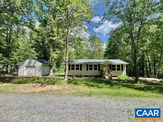 Discover this ideal home for first-time buyers in the picturesque Albemarle County! This delightful single-story home sits on 2.21 acres and features an efficient, open floor plan. The property boasts a NEW roof for both the house and the garage, a circular driveway, and a front sidewalk that leads to a patio, back deck, and garage. Inside, you'll find gleaming hardwood floors throughout, along with ceramic tile in the bathroom and laundry room. The well-appointed kitchen is equipped with recessed lighting, a generously sized pantry, granite countertops, soft-close cabinetry, and a new dishwasher. The detached garage comes with workbenches and provides additional storage space if needed. Enjoy convenient commutes to Lovingston, Scottsville, Charlottesville, or even Lynchburg, all while taking advantage of the peaceful Albemarle countryside. A spacious deck offers a serene view of the wooded land, creating an inviting retreat for nature enthusiasts. Freshly painted and move in ready!