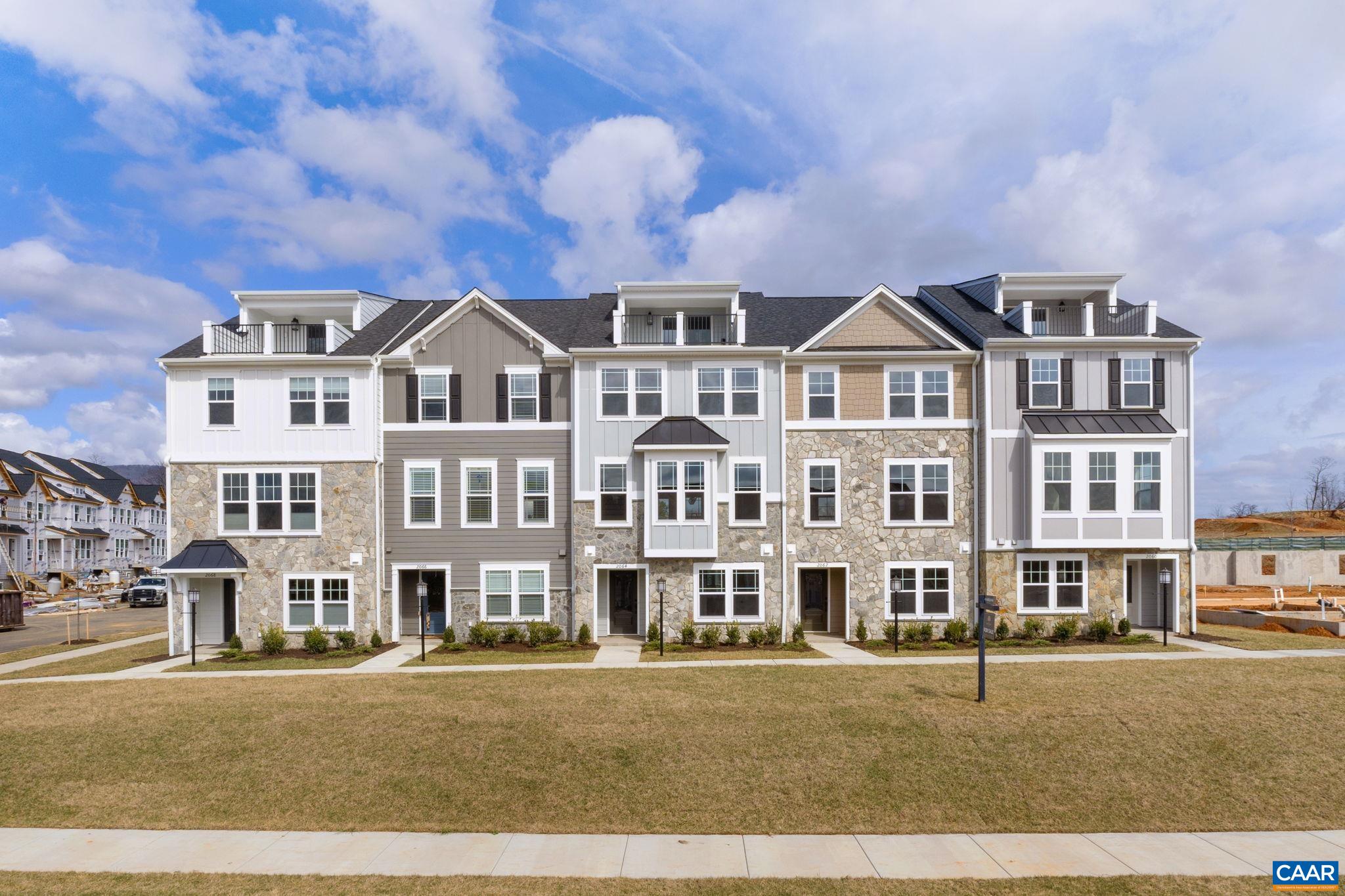 Discover the Holly II, a beautifully designed three-story townhome in the newest section of Belvedere. Fall '25 completion! This stunning home offers a spacious and flexible layout, starting with a rec room and half bath on the first floor, perfect for a home office, gym, or additional living space. The second floor’s open-concept design features a large kitchen with a walk-in pantry, a generous dining area, and a sunlit family room, ideal for entertaining or everyday living, plus an additional half bath. Upstairs, the primary suite provides a retreat with a luxurious en suite bath, while two additional bedrooms share a well-appointed hall bath. The laundry is conveniently located on the third floor, making household tasks a breeze. Thoughtful upgrades like oak stairs with open railings and gas appliances add both style and functionality. A rear two-car garage offers parking and extra storage.  Belvedere offers an array of amenities, including access to parks, close proximity to the Rivanna trailhead, the nearby SOCA Fieldhouse, a dedicated dog park for pet owners, and enchanting playground areas.  Pricing varies by elevation and structural options. Photos are of similar home and may show optional upgrades.