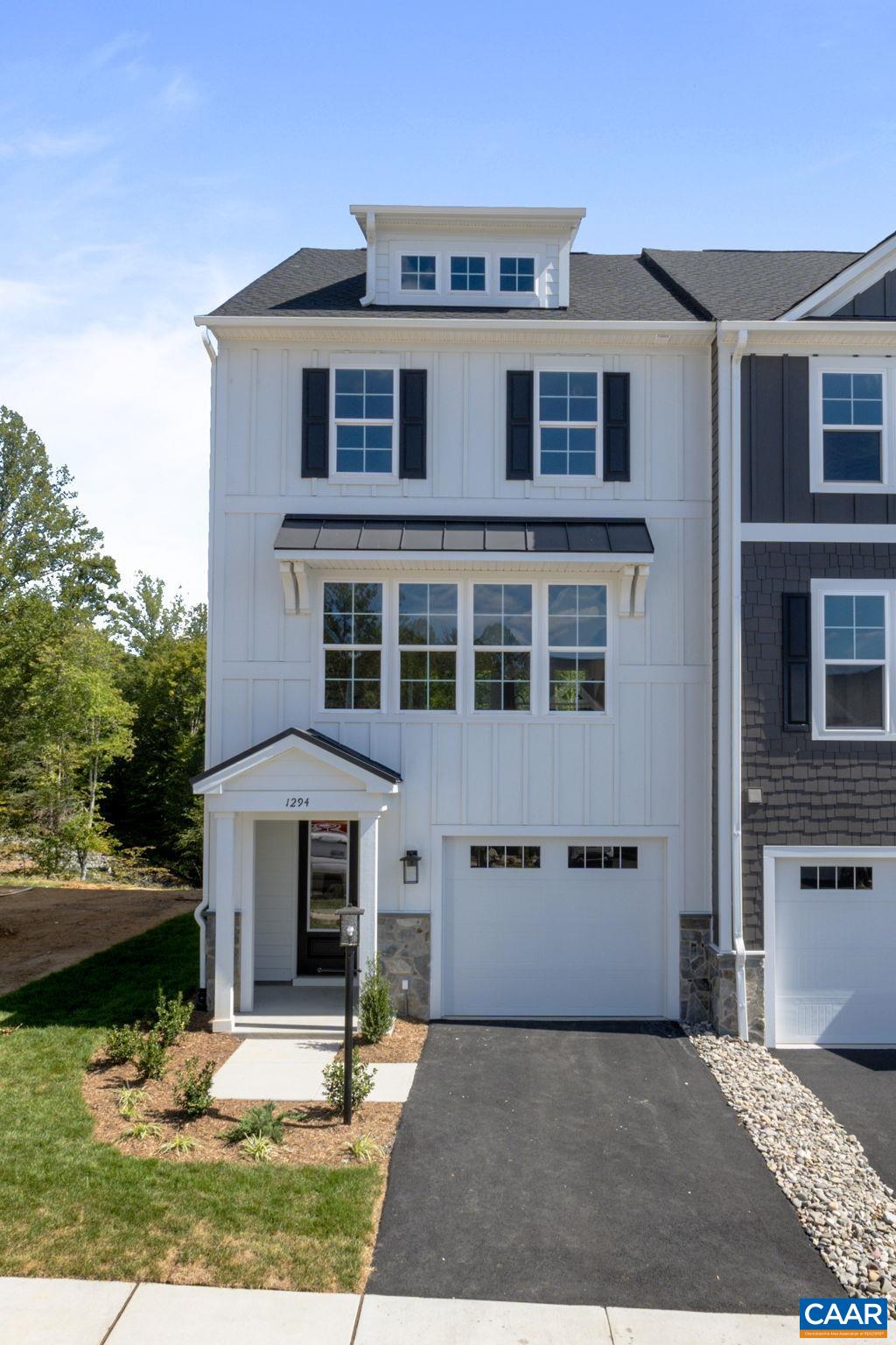 Discover the Holly I, a beautifully designed three-story townhome in the newest section of Belvedere, set for a late '25 completion! This spacious home features a flexible layout, starting with a rec room and full bath on the first floor, perfect for a home office, gym, or additional living space. The second floor’s open-concept design includes a large kitchen with a walk-in pantry, a generous dining area, and a sunlit family room, plus an included screened-in porch for outdoor enjoyment and an additional half bath. Upstairs, the primary suite offers a luxurious en suite bath, while two additional bedrooms share a well-appointed hall bath. The laundry is conveniently located on the third floor, and thoughtful upgrades like oak stairs with open railings add style and functionality. A front-facing one-car garage provides parking and storage.  Belvedere offers an array of amenities, including access to parks, close proximity to the Rivanna trailhead, the nearby SOCA Fieldhouse, a dedicated dog park for pet owners, and enchanting playground areas.  Pricing varies by elevation and structural options. Photos are of similar home and may show optional upgrades.