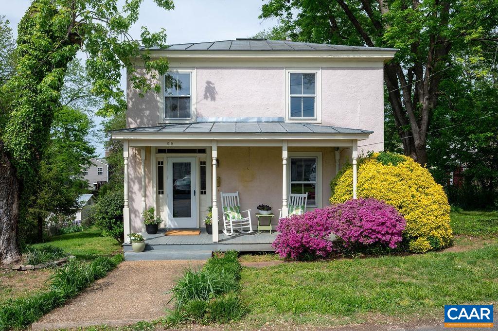 Set squarely in the center of a unique three-lot parcel in Belmont, one of the city's most coveted walkable downtown neighborhoods, this timeless 1920s farmhouse is rich in historic charm. A welcoming front porch and an expansive 12 x 24 screened-in back porch provide ideal spaces to relax and take in the beauty of the spacious, landscaped yard, which offers plenty of room for gardening and outdoor enjoyment. Inside, the classic layout features three bedrooms—one on the main level and two upstairs—along with two full baths, a cozy eat-in kitchen, a formal dining room with a striking Palladian window, an inviting living room, and a dedicated laundry room. Just a short stroll from the lively downtown mall, this home places you in the heart of the city’s best amenities—catch live music at the outdoor pavilion, see a performance at Live Arts, or dine at one of the many beloved local restaurants. The IX Art Park, local farmers markets, and ACAC fitness center are also nearby. On the market for the first time in 35 years, this is a rare opportunity to own a piece of history in an unbeatable location! RA Zoning allows for up to 3 structures to be built offering great investment opportunities for income producing potential! A rare find.