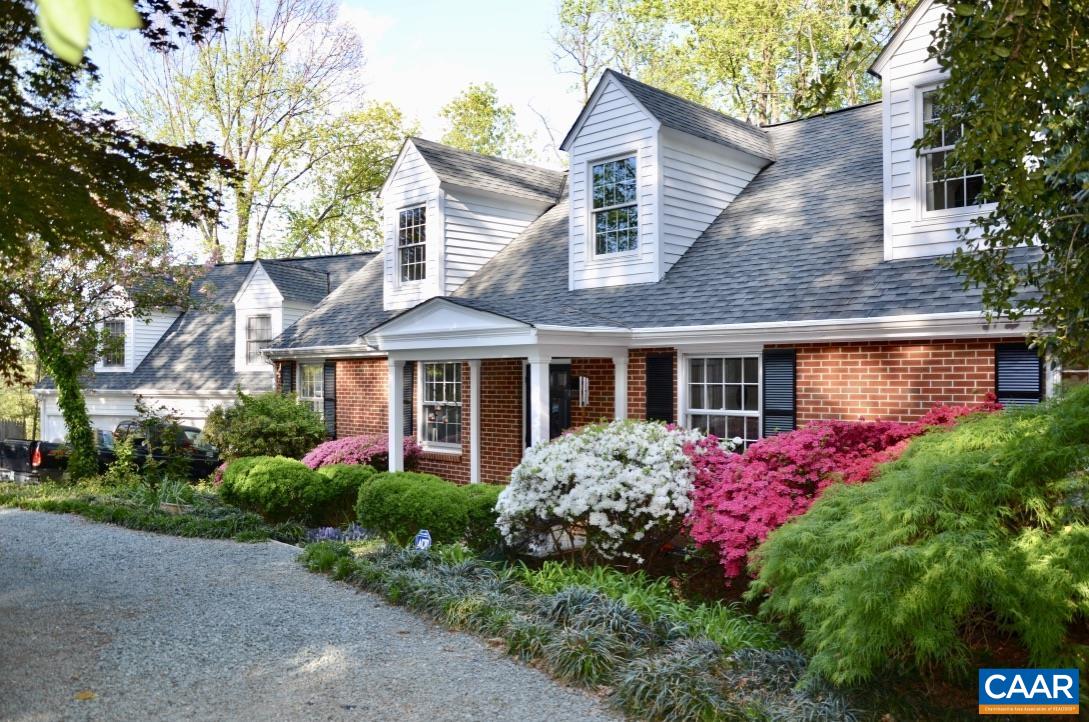 Hidden down a lane near UVA & Barracks Rd shops, find the ultimate in-town compound with privacy & flexible space on .92 acre!  Enjoy nature at home & in the guest house.  This gracious classic compound encourages entertaining both indoors and on 3 decks. Enjoy multiple primary suites, kitchens and bathrooms, three decks overlooking woods, creek & wildlife. Proven high income possible from one or more AirBnBs while living in main house. Great storage, closets & off-street parking.
