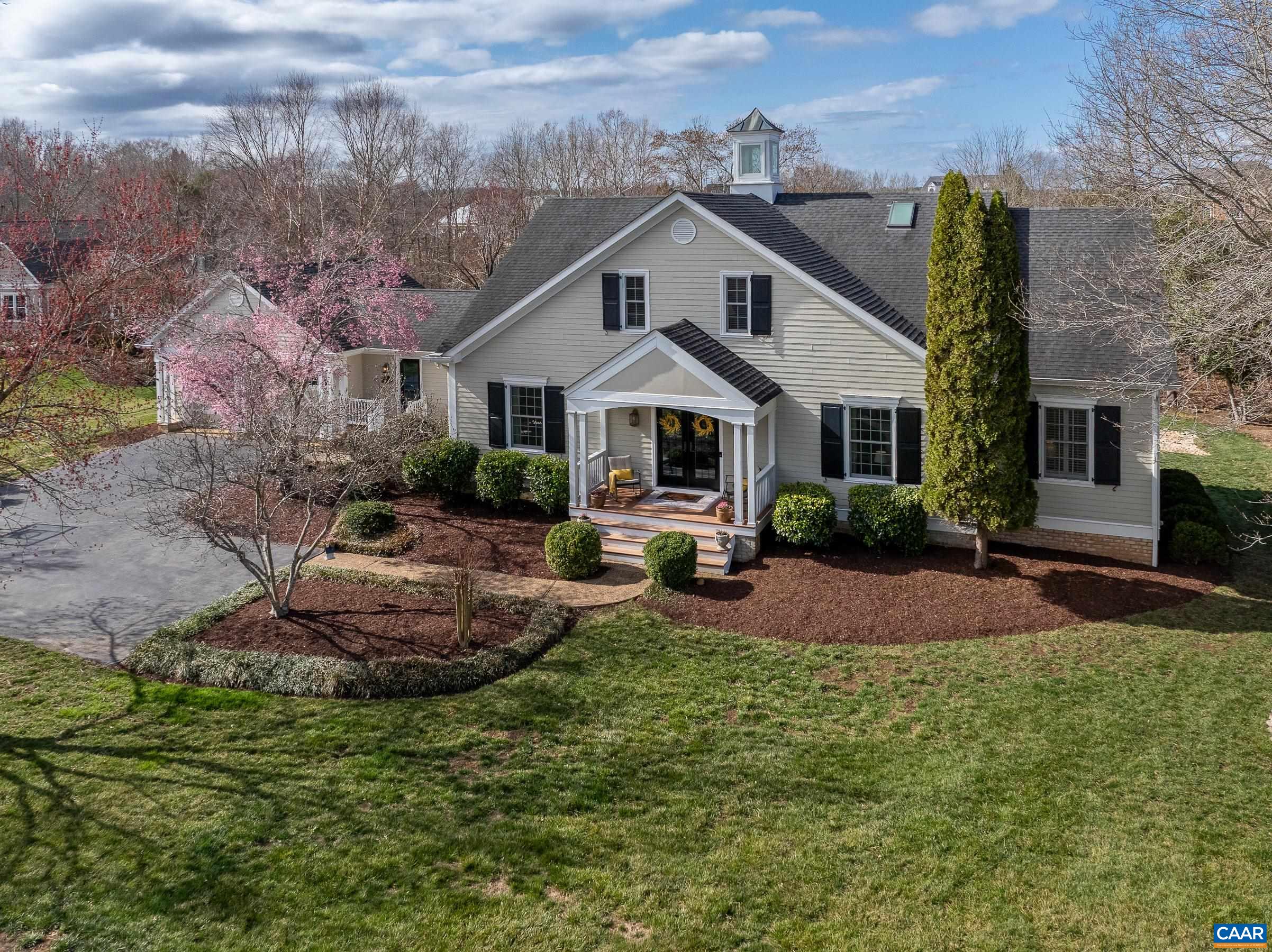 Unmatched in its craftsmanship and architectural detailing, this stunning custom home is elegant and luxurious yet incredibly warm and inviting. The flow throughout this 19th Century style farmhouse is impressive with an enormous main level primary suite, supported by three additional bedrooms upstairs and a fifth bedroom, full bath, family room, wet bar and workout area on the lower walk-out level. You will not be disappointed in the enormous primary suite complete with a separate sitting area, walk-in closet and expansive bath with heated floors.  The large nearly- level lot borders a lovely creek that meanders through the wooded area with an abundance of songbirds. Flexible closing dates or seller lease-back if needed.